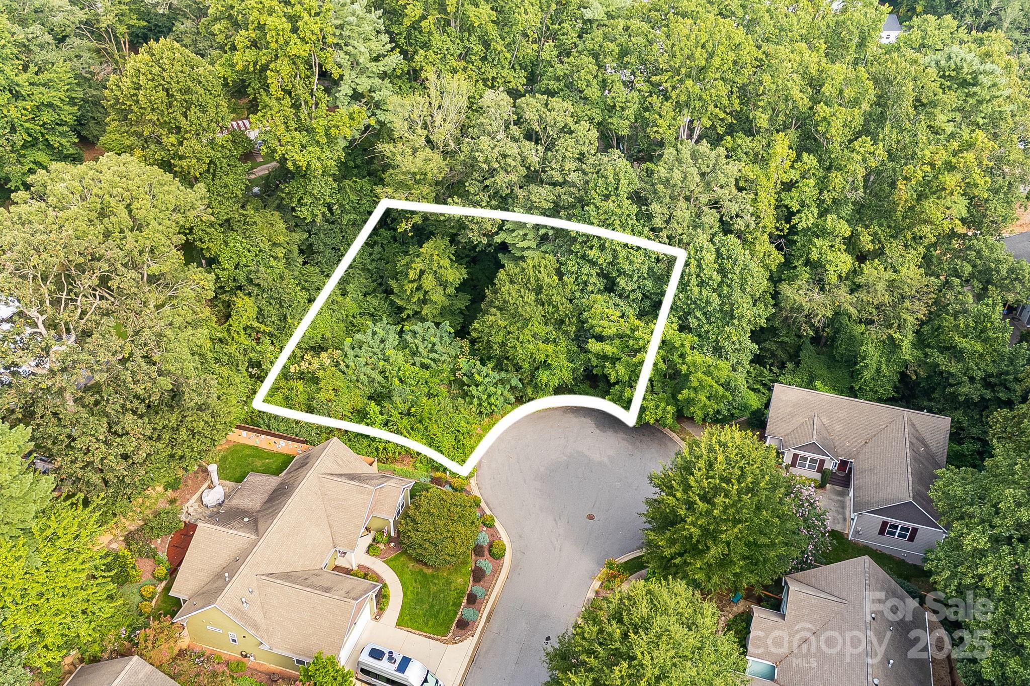 Nestled in West Asheville’s serene Catalina Court, this 0.23-acre buildable lot offers a rare opportunity to design and build your dream home just minutes from downtown Asheville and the iconic Blue Ridge Parkway. Situated in one of the area’s most desirable locations, the site is perfectly poised between natural beauty and urban convenience. A rare opportunity and tremendous value to own a piece of land that has city water, water meter and sewer taps are in place. Convenient access to a plethora of local amenities and easy reach of numerous restaurants, shopping centers, outdoor activities.