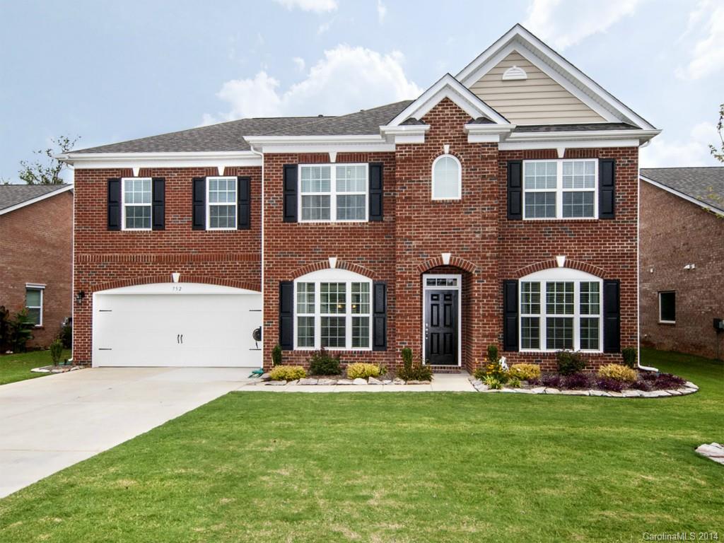 Welcome home! This stunning full brick house built by LiveWell Homes is move in ready. Enjoy the low maintenance, well appointed landscape professionally installed with a full irrigation system, custom pavers and a black iron fence enclosing the backyard. The open floor plan is perfect for entertaining.  Formal dining room, office/study, bedroom, full bath and breakfast area on the main level. Beautiful hardwood floors and lots of storage space.