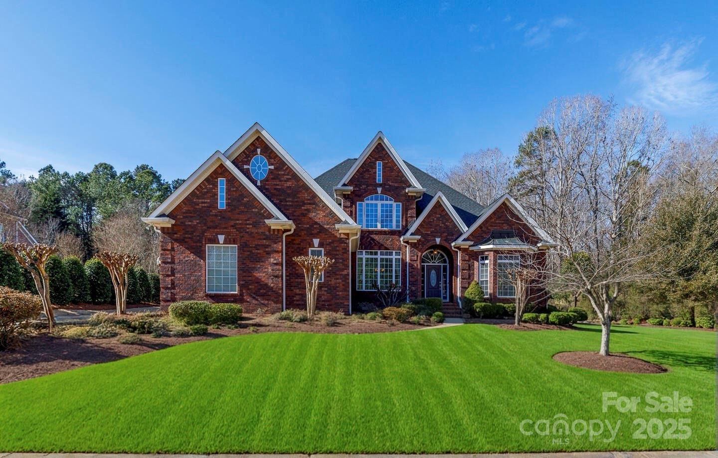 Discover your dream home nestled in the heart of Fort Mill! This custom residence is sited on 1 acre that caters to a luxurious yet comfortable lifestyle. This stunning home offers a large primary on the main level. It proudly boasts a home office w/ tiered tray ceilings, 4 large BRs, each w/ its own full bath, ensuring privacy & convenience for everyone. The open floor plan flows into the cozy family room w/ built-ins, adding character and utility. Entertainment is a joy w/a theatre room and grand outdoor setup. Picture spending weekends hosting by the inground pool & hot tub or relaxing on the screened porch. Ideal for making unforgettable memories, it includes a 900SF pool house w/ kitchen, bath, & living area w/ an unfinished attic. Storage is plentiful so you can live clutter-free. Top-ranked FM Schools, nearby access to the Catawba River & Charlotte is just a short drive away.
This gem is the perfect setting for creating memories! Don’t just buy a house; elevate your lifestyle!