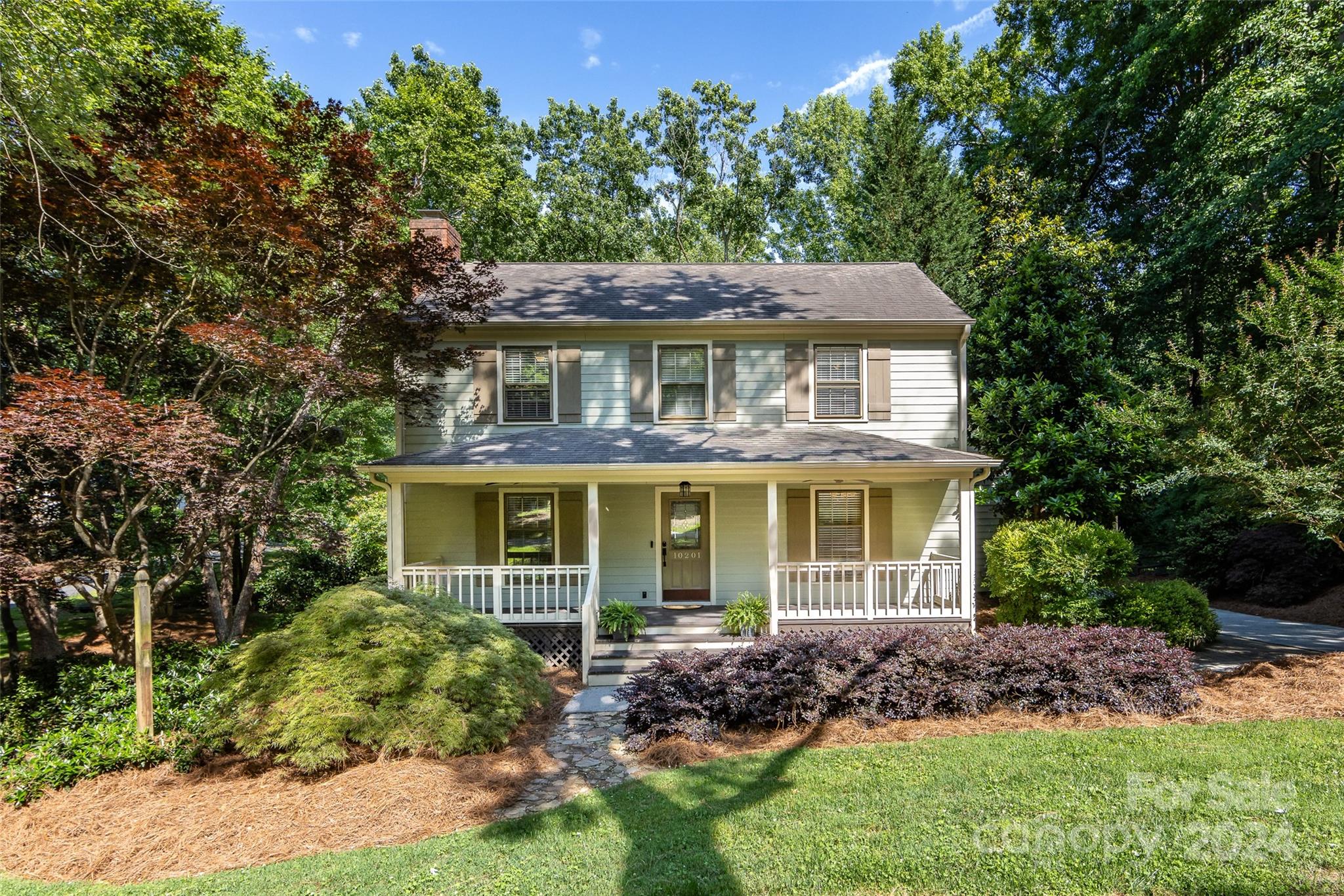 Welcome to 10201 Rocking Chair Road. This charming home is steps away from the neighborhood entrance to Francis Beatty Park. With top rated schools and convenient Matthews location, this home is nestled on a .59 acre lot with heirloom trees and landscaping. Relax on the large covered front porch that greets you as you enter. Freshly painted interior throughout. Great layout with the kitchen/breakfast room open to the den with gas log fireplace. Kitchen updates include wood cabinets and granite countertops. Mudroom/laundry and half bath off the driveway entrance. Upstairs features primary suite and two additional bedrooms and full bath. Fiber cement exterior and large deck overlooking expansive backyard. Two storage sheds, one is wired and makes a great workshop. Hearthstone is a beautiful neighborhood with large lots and no HOA. Home is not in the city limits. It is unincorporated Mecklenburg Co. This home is sold as is.