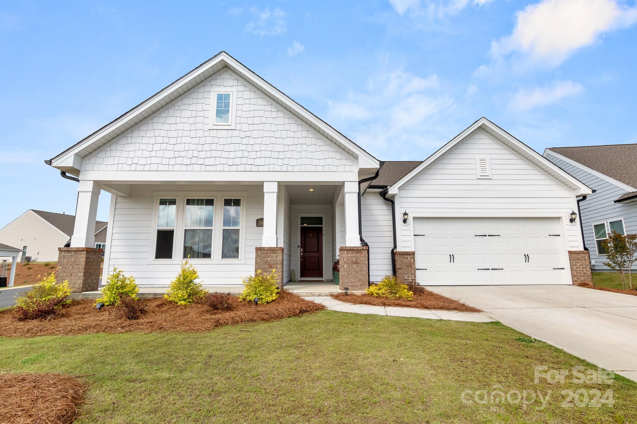 This almost brand new home built in 2022, offers the perfect blend of modern design & practical layout in one of Fort Mill's most desired neighborhoods. Featuring two master suites on the main floor, this home is ideal for multi-generational living or hosting guests. A spacious office provides a quiet space for working from home, while upstairs, you’ll find two additional bedrooms and a full bath. The kitchen in this home is stylish and practical with white cabinets, large kitchen island and double oven makes cooking & entertainment easy. The open concept ensures that the kitchen flows into the living area. Situated on a quiet corner lot in a cul-de-sac, the home is full of natural light, creating a warm and inviting atmosphere. Living in Fort Mill means enjoying a vibrant, family-friendly community known for its top-rated schools, abundant parks, and easy access to the best of the Carolinas with shopping, dining, and entertainment just minutes away. Community with amazing pool.