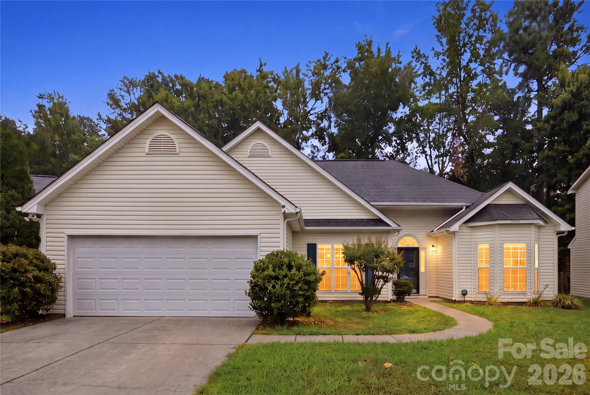 Welcome home to this charming 3-bedroom, 2-bath residence offering a thoughtfully designed split floor plan that provides privacy and comfort. The spacious primary suite is tucked away from the secondary bedrooms, creating a peaceful retreat at the end of the day.

The inviting living room features a vaulted ceiling that enhances the open feel of the home, while updated light fixtures add a fresh, modern touch throughout. The functional layout flows seamlessly, making it ideal for both everyday living and entertaining.

Step outside to enjoy the fenced backyard, perfect for pets, play, gardening, or relaxing outdoors. A two-car garage offers ample storage and convenience.

Conveniently located close to dining, shopping, and everyday amenities, this move-in-ready home combines comfort, style, and an unbeatable location. Don't miss your opportunity to make this Rock Hill gem your own!