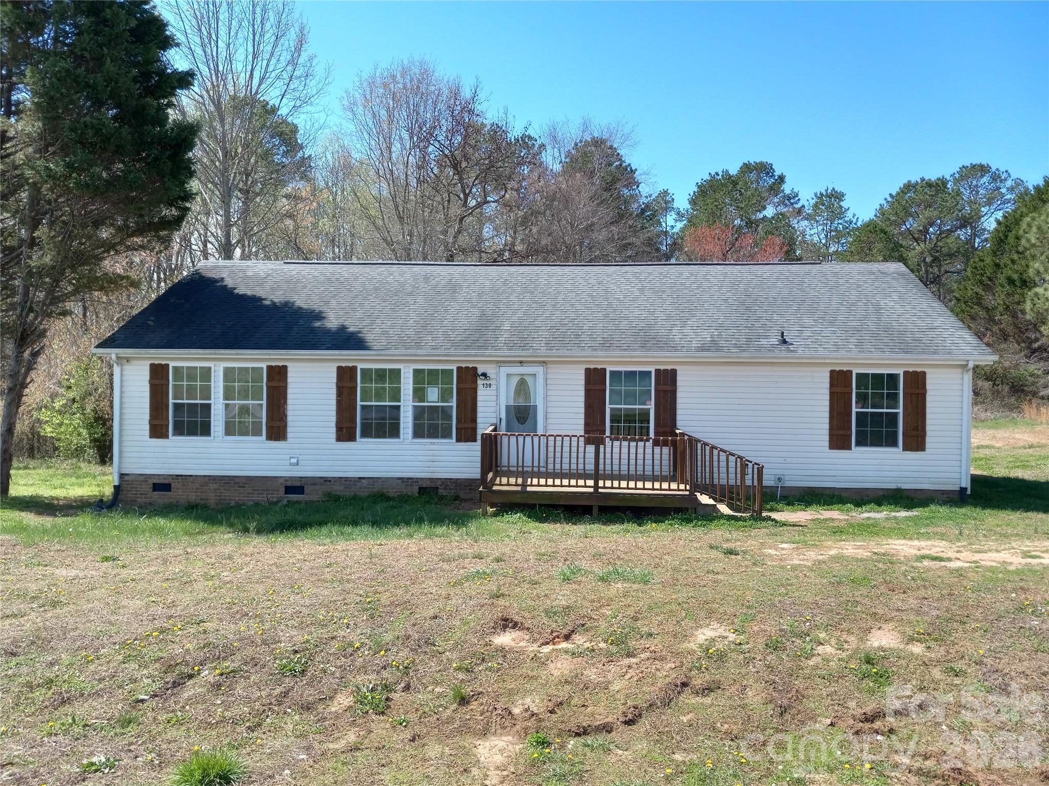 Attractive home on a beautiful 1.2-acre lot!  Incredibly peaceful view out back!  Large home with two living spaces!  Split bedroom plan!  Kitchen opens to one of those living spaces!  HVAC manufactured in 2022!  Roof seems to have been replaced at the same time, but cannot confirm!  A few days of sweat equity and you'll have a gem!