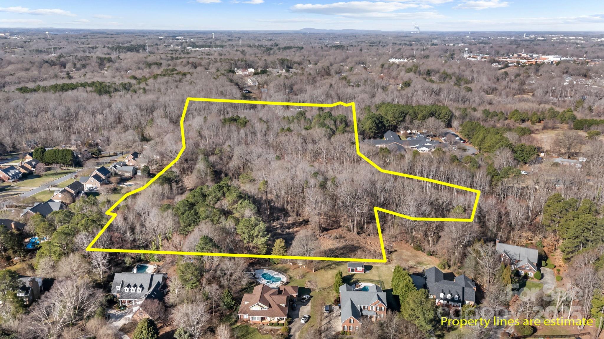 Approximately 16 acres of beautiful expansive land located in the city of Mooresville with city water and city sewer available.  Located within an upscale neighborhood.  One of the last large tracts left in Mooresville to be developed with public utilities. This property is perfect for a residential development with expansive homes on larger lots.  Experience being close to downtown Mooresville but a private living location close to schools and parks.  Just a 30 minute drive into Charlotte.