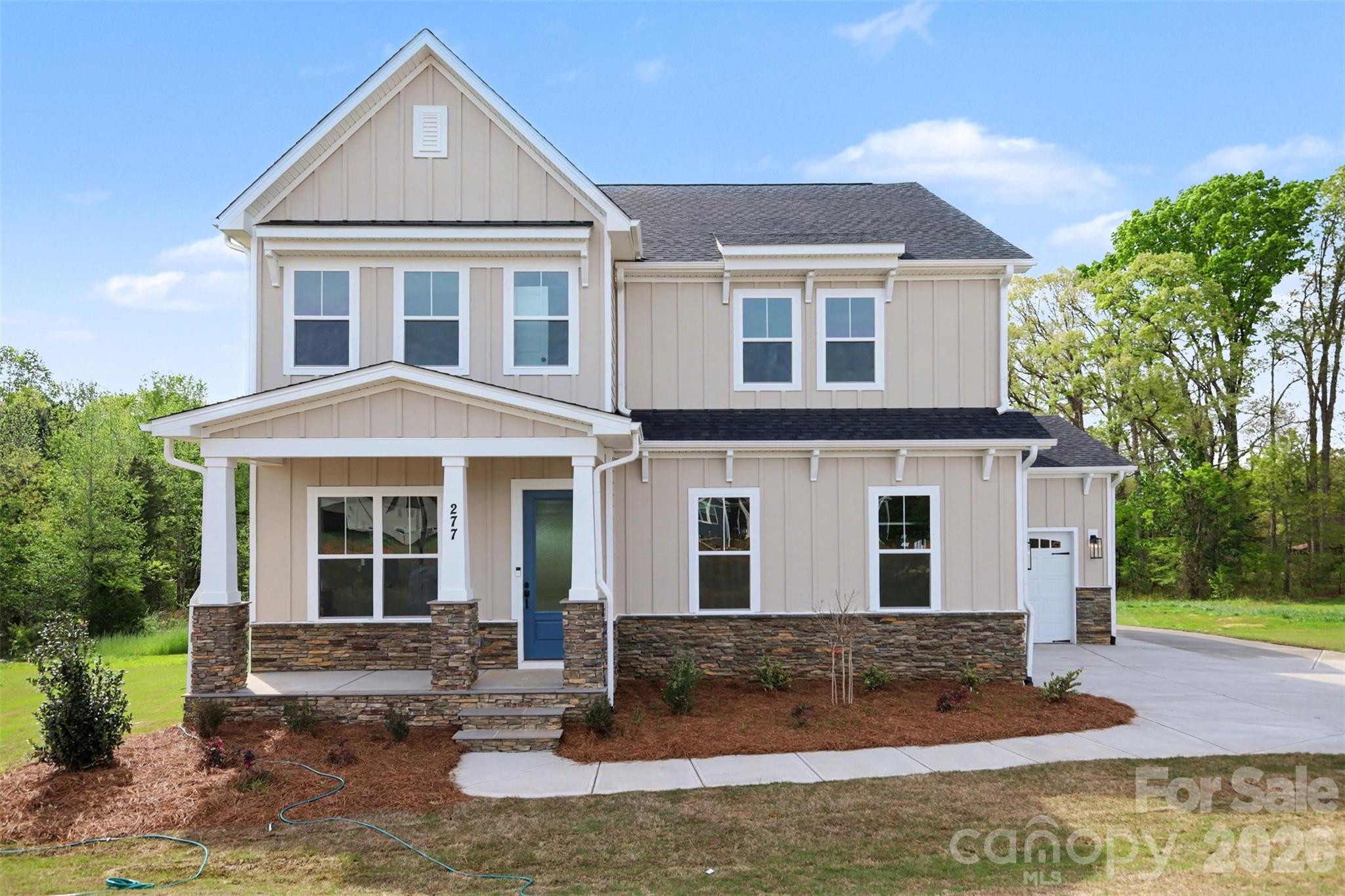Ready for you to move in! This NEW CONSTRUCTION home on 1+ acre homesite, offers an open floor plan designed to connect indoor & outdoor living. This stunning home features 10' ceilings on the first floor, 9' ceilings upstairs. The gourmet kitchen boasts double wall ovens, floor-to-ceiling cabinets, & quartz countertops, centered around an oversized island that connects to the living area that features a casual breakfast area, family room with modern gas fireplace, and formal dining area, with the family room opening to the large back deck! The open floor plan includes a guest suite on main, and elegant hardwood floors throughout 1st floor (except bath). Upstairs, the owner’s suite offers a tray ceiling, luxurious bath with dual vanities, quartz countertops, walk-in tiled shower & walk-in closet. A huge loft upstairs provides space for entertainment. Closing cost contribution available w/preferred lender! Some photos are representative of previously built home and may show upgrades not included in completed home on this site. Options, layouts, etc may differ from photos and some items listed in MLS may change during construction - please verify all options with community agent.  Other homesites & plans are available!