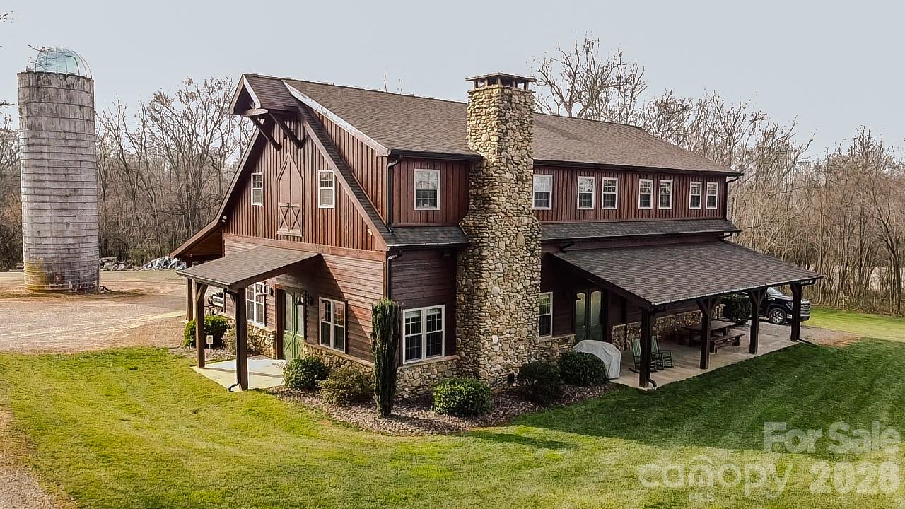 Welcome to Big Oak Tree Farm, a beautiful recreational property designed for the outdoorsman who loves the peace and quiet of the North Carolina countryside! This luxurious offering provides a back to nature escape with true rustic elegance and a lodge-like feel!

The main floor living room is enormous! A huge river rock fireplace is the centerpiece of the room with 12-foot vaulted ceilings and hand hewn barn beams that accent the ceiling!  Stained concrete floors cover the entire first level of the home.
The main floor also offers a kitchenette, laundry and mud room, small office/storage space, bedroom that is a workout room and full bath.
The second floor has a full sized kitchen complete with granite countertops, double over, gas top stove, hand hammered copper sink.  There is also a nice pantry nearby.  The kitchen, dining room and living room are all part of the open space.  The main bedroom is over sized for plenty of space and the master bathroom has granite countertops, a heated tile floor and walk-in shower.  There is a huge walk-in closet and office nook.
The second bedroom upstairs is setup with bunk beds for children and extra guests.  It has it's own full bath and tile shower.
The exterior of the home is constructed of cedar from top to bottom!   The large front porch overlooks the farm ground to the north and provides ample space for enjoying the quiet scenery.   With over 1000 covered square feet along the backside of the home, the owner has several pieces of farm equipment and firewood stored there to keep them out of the elements. The support beams along this covered space are solid cedar measuring 8?x8?!

With entrances on all four sides of the home, access is easy.  The insulated garage is located on the west side of the home and it offers over 1200 square feet with tall ceilings and has plenty of room for one vehicle or side by sides and ATVs.  It also has a work bench area, industrial sink with a dog wash next to it and plenty of floor space for more storage.  The garage is also setup with a propane connector so it can be heated.

The entire property is made up of two parcels and boasts 201.83 acres of prime recreational ground!  A mile long section of Sills Creek runs right through the heart of the property providing a great water source for the land and the wildlife. 
This land has been cultivated by the owner into a prime hunting and recreational property!  With a good mix of timber and open spaces, there are plenty of dialed-in food plots and fields planted in corn and soybeans equipped with Redneck hunting blinds and Family Traditions ladder tree stands!

With a side by side or ATV you can use one of the many trails to reach any section of the property to hunt!  There are even some great hunting blinds within a minute’s walk from the house!

All total, there are approximately 45+/- acres of food plots and planted tillable acreage that have been consistently planted and maintained by the current owner and a local farmer.  A mix of summer and fall food plot blends along with corn and soybeans have been the main source of food for wildlife on the property.

There are two easements across the property.  One is a power line easement and the other is a gas line easement.  Both provide great areas for multiple food plots and tillable ground for crops.  The property is also held in a conservation easement and documents can be obtained by request of interested buyers.