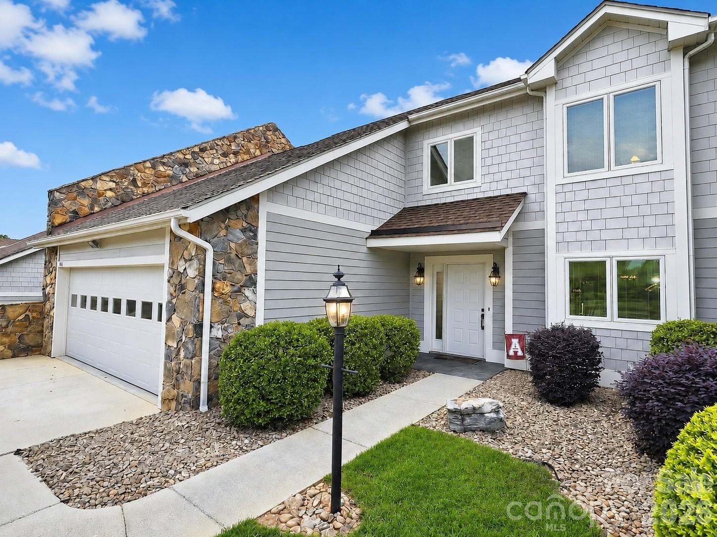 Experience resort-style living in this beautifully maintained townhome located in the highly sought-after Rock Barn Golf & Spa Community. From the pristine walkway leading to the front entrance to the stunning golf course views, this home offers the perfect blend of comfort, privacy, and elegance.

Step inside to an inviting open floor plan filled with natural light from soaring skylights. The spacious living room features a cozy woodburning fireplace and sliding glass doors that open to a spacious Trek maintenance free deck overlooking the 11th hole of the renowned Tom Jackson Course. 

The main-level primary suite provides convenient single-level living and includes 2 generous walk-in closets and private full bath. Adjacent to the living room, a versatile sitting area creates the perfect space for reading, relaxing, or a home office as well as a convienent half bath access for guests. The kitchen is equipped with new appliances and ample storage.

Upstairs, you'll find two spacious bedrooms, each with walk-in closets, along with one full bath and a large walk-in attic offering abundant storage space. The attached two car garage adds convenience, while exterior maintenance is handled by the HOA, allowing you more time to enjoy everything the community has to offer.

Recent updates include a new HVAC system (2024) and Trek Deck ensuring a maintenance free lifestyle while providing peace of mind for years to come.

As a member of Rock Barn Country Club (optional), you'll enjoy access to an unmatched collection of amenities, including two championship golf courses: the Tom Jackson Course and the renowned Robert Trent Jones Jr. Course—a fitness center, outdoor pool, tennis courts, and on-site dining. The community's award-winning spa offers luxurious amenities including massages, facials, hot tubs, and indoor waterfall pools. A vibrant social atmosphere with community events, live entertainment, dinners, and private event spaces creates an exceptional lifestyle beyond the home itself.

Whether you're seeking a primary residence, a golf retreat, or a low-maintenance luxury lifestyle, this exceptional townhome offers the best of Rock Barn living. Schedule your private showing today and discover why so many are proud to call this community home.