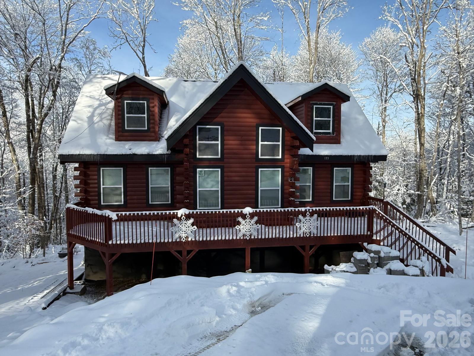 Escape to the ultimate mountain lifestyle at 133 Greenbriar Road. This stunning 3-bedroom, 2.5-bathroom authentic log cabin perfectly blends rustic High Country charm with modern comfort. Nestled in the heart of beautiful Beech Mountain, NC, this property is nestled in a peaceful sanctuary surrounded by nature. Whether you are looking for a serene full-time residence, a weekend getaway, or a lucrative STR rental, this home delivers the quintessential mountain experience.