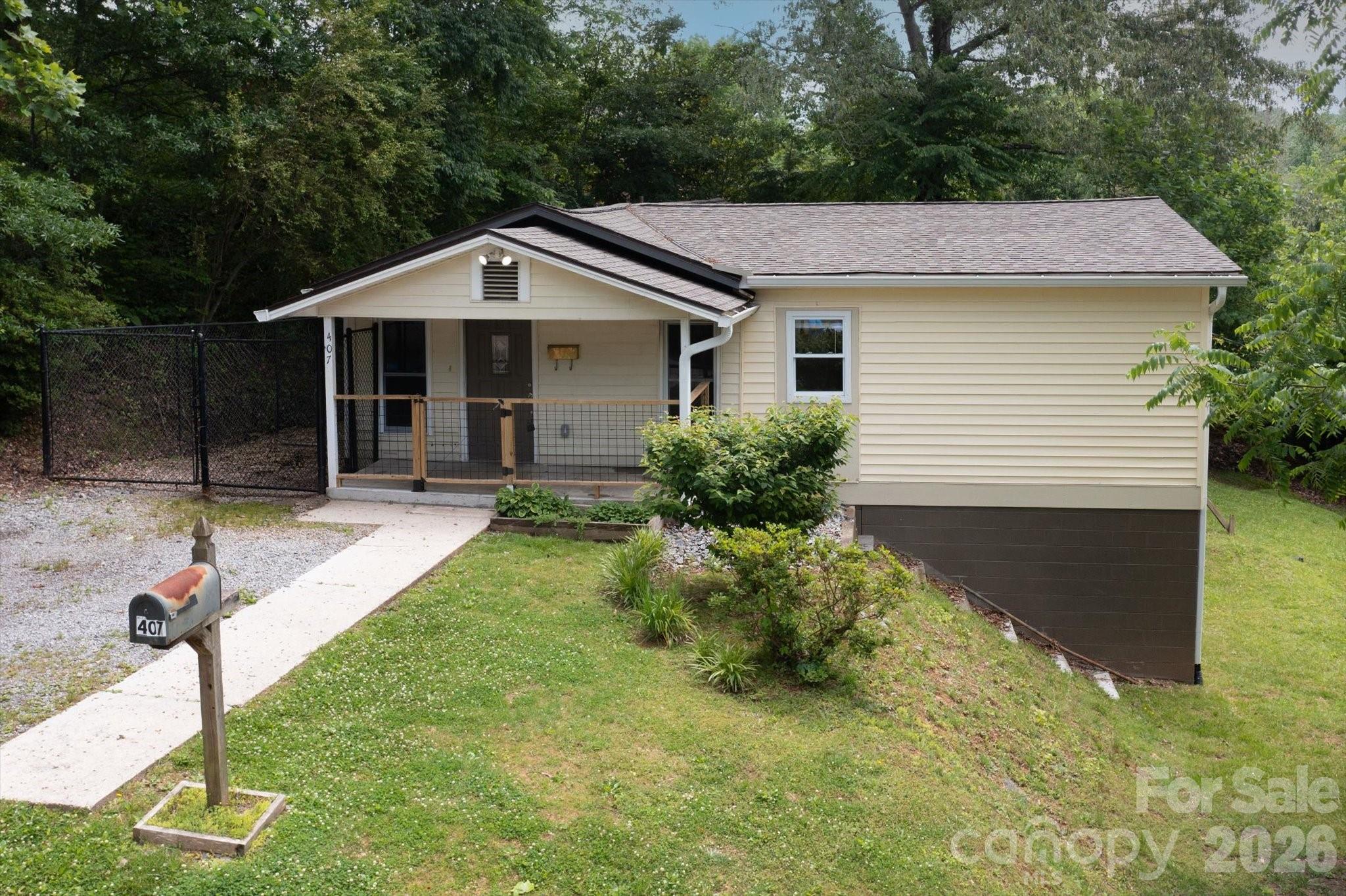 Excellent location on West Main Street in downtown Brevard. This 3/2 home offers one level living,  an open floor plan, large primary suite, fenced back yard, unfinished basement, easy access to the hike/bike path, and convenience to all of downtown's amenities without being in the middle of the hustle and bustle. The basement, accessed from outside, is the perfect spot to store bikes or create a workshop. This home is a must see for anyone wanting an easy, convenient lifestyle and in town living.