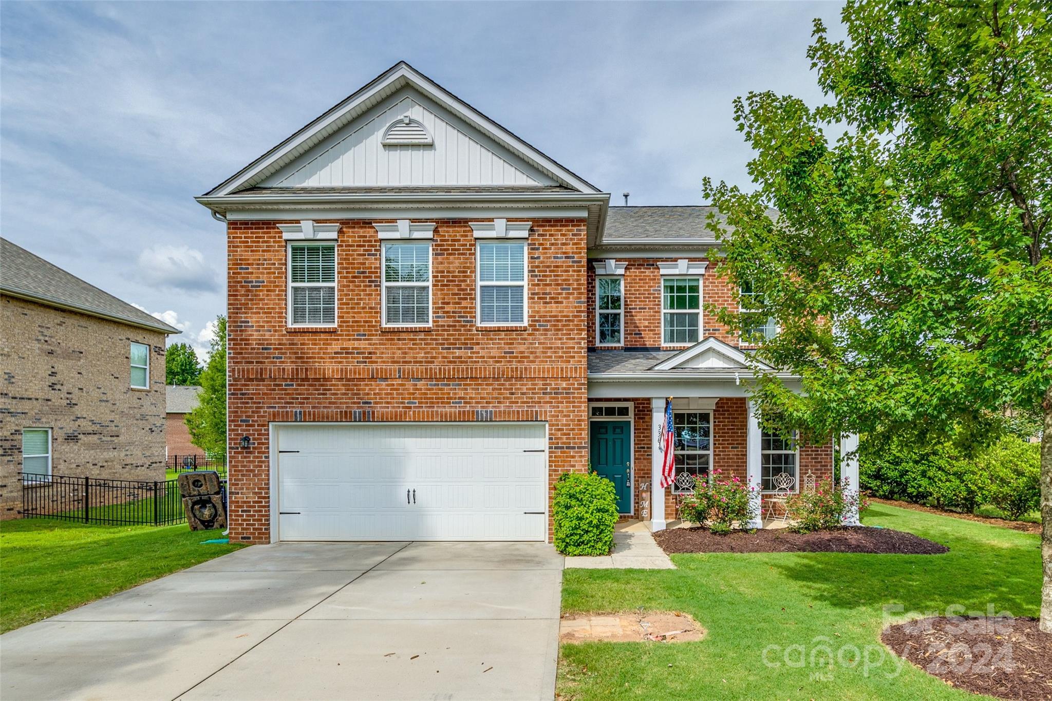 Welcome to the all-brick homes, tree-lined neighborhood of Riverwood! This 4 or 5 bedroom house boasts a remodeled first floor in 2020 with 9 ft ceilings, custom cabinetry, countertops, appliances, recessed lighting, LVP floors, new millwork, bathroom vanity, mirror and fixtures. Upstairs, the custom millwork was carried over into the primary suite and the upstairs laundry room makes doing laundry convenient.  Outside, the property backs up to a large common area green space that is accessible by a gate in the fence that surrounds the whole back yard.  In 2023, the owners built an outdoor living space with ceiling fans, TV and bluetooth speakers.  The 2-car garage includes wall mounted cabinets and overhead shelving. You don't want to miss this well landscaped, well-maintained, one owner home near newly renovated Ebenezer Park on Lake Wylie.

The washer/dryer, filing cabinets and fridge in garage do not convey.
All kitchen appliances, outdoor TV and outside play set convey.