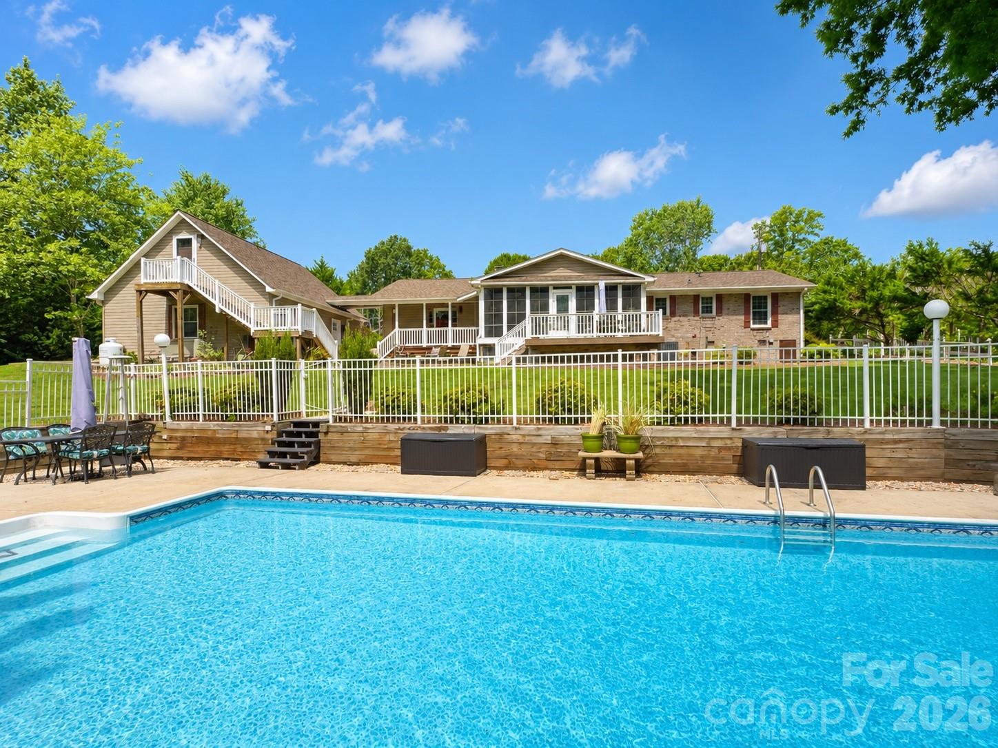 Welcome home to this beautifully maintained full-brick ranch nestled on a private 1.28-acre cul-de-sac in a quiet Mt. Holly neighborhood. Includes a pool and detached garage. Offering the perfect blend of comfort, space, and privacy, this one-story home features 3 bedrooms, 3 full bathrooms, a bonus room, and an open-concept floor plan centered around a cozy fireplace. The updated kitchen showcases granite countertops, stainless steel appliances, and plenty of workspace, flowing seamlessly into the main living areas—perfect for entertaining or everyday living. Enjoy the bright, oversized sunroom year-round, overlooking your own backyard retreat. Step outside to a stunning in-ground pool, expansive Trex decking, and a large, private backyard designed for relaxation and gatherings. An extended driveway provides ample parking, while the detached garage with a finished apartment above offers endless possibilities for guests, a home office, rental income, or multigenerational living. The included rear lot ensures no one can build behind you, creating exceptional privacy rarely found. With mature landscaping, plenty of outdoor space, and a peaceful setting just minutes from shopping, dining, and major highways, this property offers the best of country-style living with everyday convenience. A truly one-of-a-kind opportunity in Mt. Holly with no HOA!