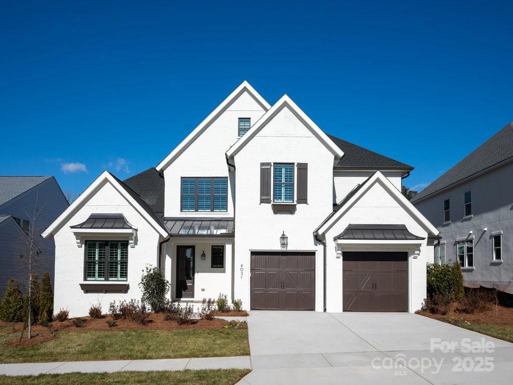 Fall in love with this beautiful English Cottage home by Charlotte's locally owned, and nationally recognized luxury homebuilder. Move-in ready now and located in Fort Mill's boutique community, Arden Mill, where walkability, gorgeous landscaping, pocket parks and privacy are the hallmarks. Minutes from Kingsley and close to elementary, middle and high schools. Awarded "Best Floorplan in the Country", the Monterey explodes with personality. Inspiring oversized kitchen and spacious Great Room with vaulted ceiling. A Dining Room with stacking sliding doors, opens to the Outdoor Living Room, blurring the line between indoor/outdoor spaces. The Main Level Primary suite boasts a vaulted ceiling and is separated from the living area with a vestibule and hallway, ensuring privacy. The Primary bath spa atmosphere is sure to delight. Upstairs, a large Bonus Room and three bedrooms with walk-in closets and ensuite baths are tucked away off of a private hallway.