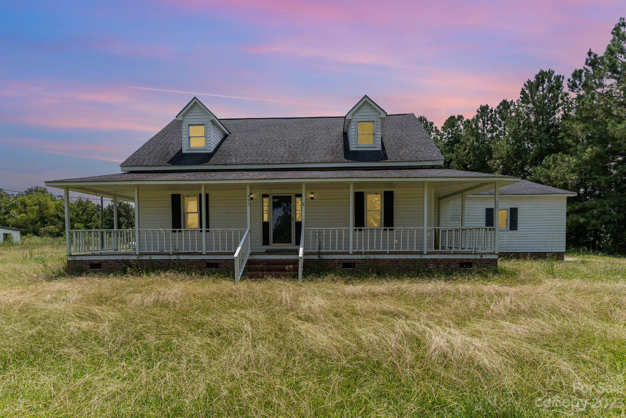 BACK ON THE MARKET AT NO FAULT OF THE SELLER!!! This 100 year old beauty sits on approx. 29 acres providing complete harmoneous bliss for anyone looking to get away from the hustle and bustle of a busy city life. It boasts 3 bedrooms and 2 full baths with the primary bedroom on the main floor, while the other two bedrooms are upstairs. The fireplace is located in the living room and it also has a formal dining area. To the right of this propery,  is a horse barn with 6 stables that once served as a rescue center for horses and other animals. In the back of the property, there is a half acre-25 feet deep pond for irrigation ready for use to harvest crops! The wrap around porch is perfect for tea or coffee on a rainy day, early morning peace retreat or a reset on a Sunday afternoon! Propery is 10-15 minutes from shopping centers, food resturuants and medical help if needed. This property is also located 1 hour from Myrtle Beach, SC. This home needs some TLC and a loving owner.