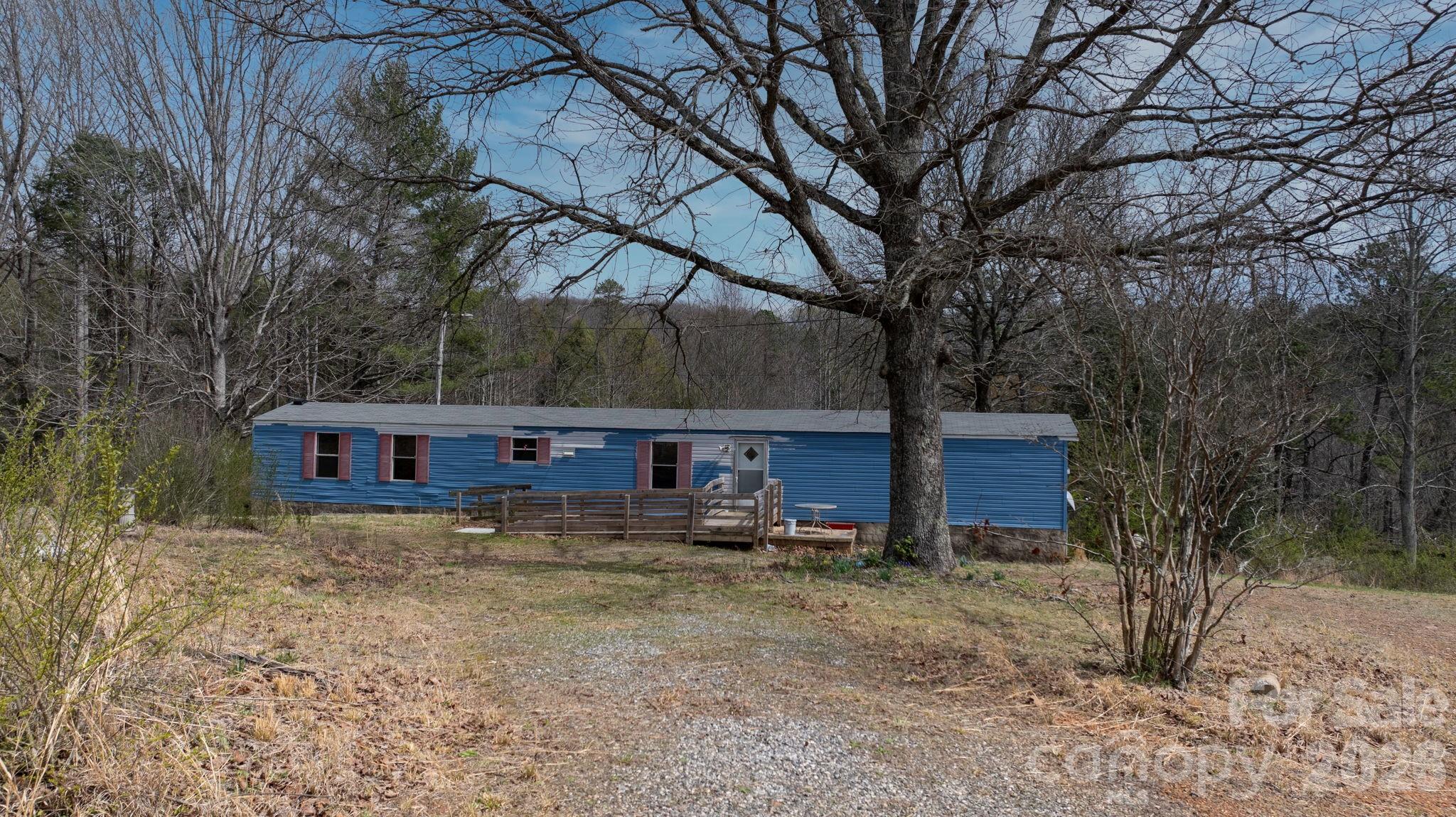 Nestled on 2.87 private, wooded acres near the end of a quiet cul-de-sac, this property offers a unique opportunity to enjoy peaceful country living with plenty of space to make your own. This one-level home features a split-bedroom floor plan, a spacious living area, and a large eat-in kitchen with abundant cabinet space.

The primary suite includes a recently updated walk-in shower and is thoughtfully positioned for privacy from the additional bedrooms. A dedicated laundry room is conveniently located just off the kitchen.

With nearly 3 acres, there is ample room to expand, garden, or simply enjoy the natural surroundings. Whether you're looking for a primary residence, weekend retreat, or investment opportunity, this property offers flexibility and potential. No HOA.

Water system is currently not operational and will require repair. Property is being sold as-is.

Don’t miss your chance to own a private slice of Burke County with room to grow.