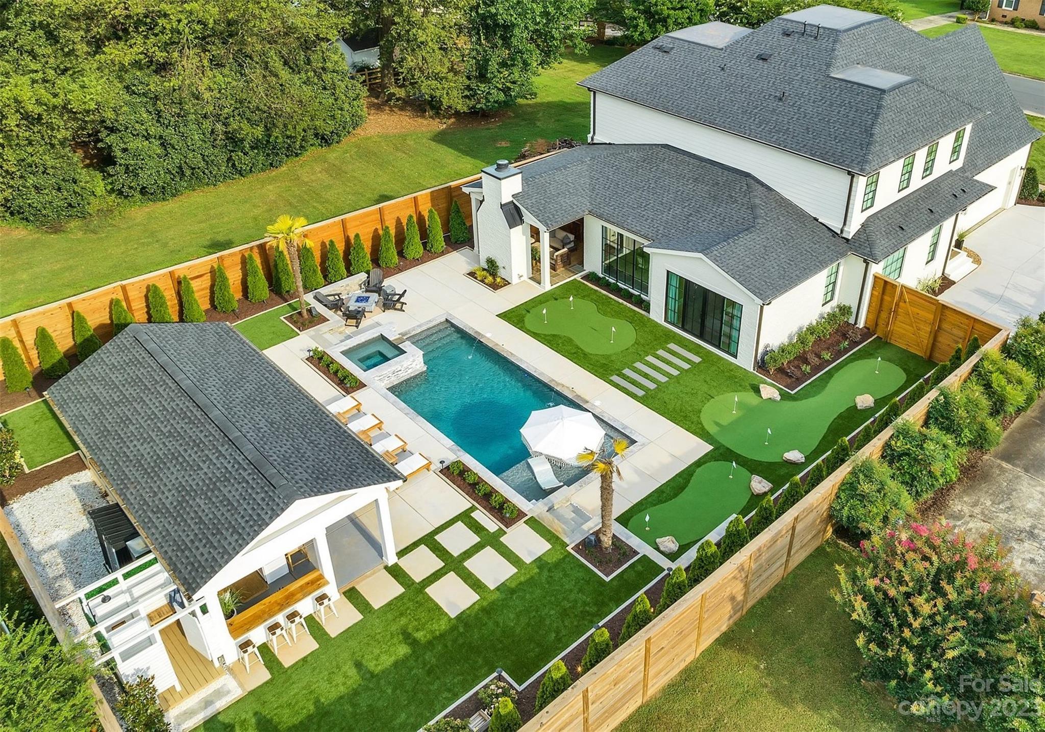 A unique opportunity to own this beautifully redesigned custom luxury home in the desirable Ashbrook neighborhood. Following an extensive 16-month interior and exterior renovation, this entertainer’s paradise was created with a custom designed backyard boasting complete privacy for year-round entertainment. The backyard features a heated pool/spa w/waterfalls, artificial turf, three putting greens with LEDs, grill area, fireplaces and a Cape Cod outdoor shower. The highlight of the backyard centers around the fully equipped cabana with dual bars, fans/heaters, Bahama shutters and much more. On the interior, the lower level features an open layout with floor to ceiling windows/doors, an office/guest, chef’s kitchen with high-end appliances, scullery, wine room and a redesigned primary suite with dual vanities, standing tub and a private entry to the pool area. The second floor features a spacious loft with built-in desks, three bedrooms/bathrooms, bonus room with a bar and storage room.