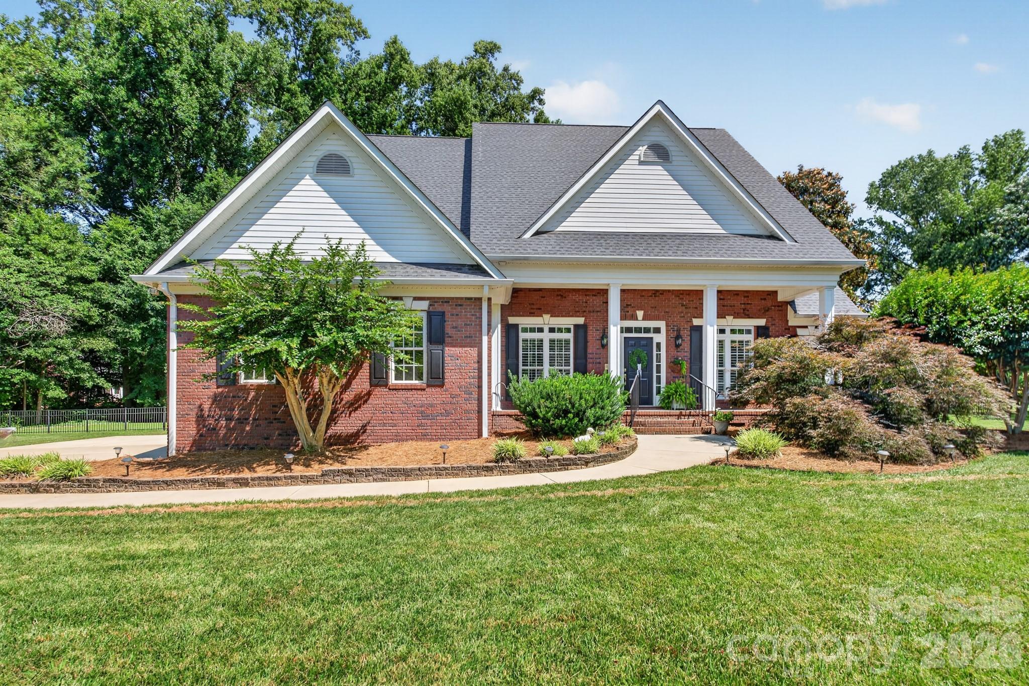 Located on a quiet cul-de-sac road in Miller Pond, this all-brick home on a 0.76-acre lot is going to check off the boxes on your wish list!  As you enter this home from the welcoming front porch, you will be impressed with all this home has to offer. Enjoy preparing your meals in the updated kitchen with white cabinets, quartz countertops, and stainless appliances.  Entertainment space will be enhanced with a separate dining room as well as a kitchen breakfast area.  The spacious family room will provide the perfect spot for gatherings or simple evenings just relaxing by the fireplace. The main level primary suite features a bedroom and private bath with tub, separate shower, and double vanity.  The main level is also home to three additional bedrooms, one of which is currently serving as a home office.   One of the bedrooms is equipped with a full bathroom, making a wonderful guest suite, if needed.   As you make your way up the staircase, prepare to be enthralled with the space awaiting.  An expansive bonus room provides so many opportunities – and it leads to a fabulous space that is perfect for theater room, home gym, or so many other possibilities.  A fifth bedroom is on the upper level as well as a full bath and a flex space that offers potential for so many options.  Don’t forget to check out the vast floored walk-in attic with an amazing amount of storage space.  Looking for outdoor living?  Check out the incredible amount of room on the newly painted back porch/deck that overlooks the large fenced-in backyard!  You will love the privacy and serenity it provides.  Come see all this beautiful home offers that provides the following recent updates: refinished hardwood floors on the main level (2025), new carpeting (2025/2026), new paint (2025/2026), two refurbished bathrooms on the main level (2026), new roof (2024), and so much more.  Make your appointment today as your first step in making 932 Gristmill Drive your new address!