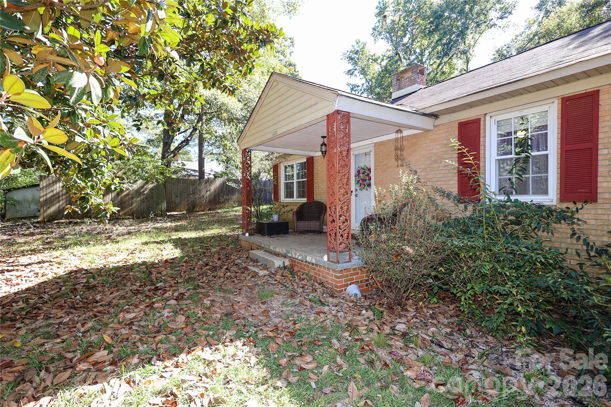 Solid, all-brick ranch with massive financial value and endless potential! Nestled on a private, tree-lined half-acre lot close to downtown Lancaster, this freshly painted 2-bedroom, 1.5-bathroom home has just been professionally deep-cleaned and is ready for its next chapter. Step inside to a bright living room with a cozy fireplace, a large eat-in kitchen with abundant cabinetry, and a flexible dining/sitting space. The primary bedroom features a unique connected bonus room—perfect for an oversized walk-in closet, home office, or nursery.

This home  Lancaster home also offers a full hall bath and a convenient half bath off the kitchen. Outside, relax in the private backyard surrounded by mature trees—perfect for outdoor entertaining, gardening, or pets. A covered 2-car carport and extended driveway with a turn-around provide easy parking and storage.

Located close to downtown Lancaster, schools, parks, and shopping, this home is ideal for buyers looking for comfort, convenience, and plenty of outdoor space in a quiet setting.  this home has an assumable mortgage through movement per the seller.