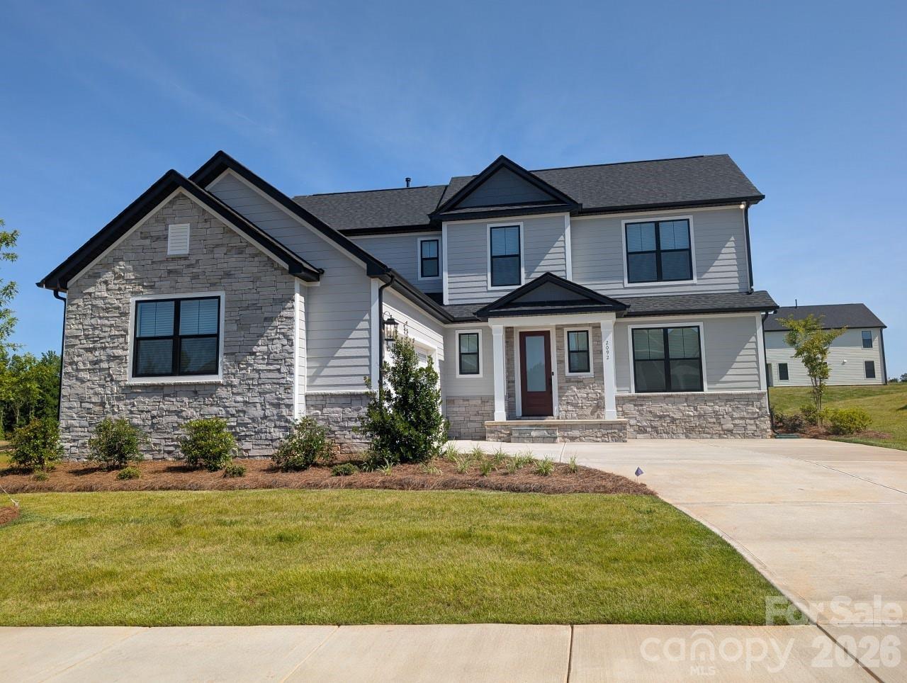 MOVE IN READY!! Welcome to the beautifully designed 3-bedroom, 2.5-bathroom Lancaster! The first thing you notice when you pull up is the beautiful sodded lawn with in-ground irrigation and a side load garage. As you enter, you're immediately greeted by a spacious family room. LVP flooring and blinds are throughout the downstairs. This is the space where laughter is sure to fill the air and game nights will be abundant. This open floor plan extends into the kitchen with a huge quartz island to gather around. The Lancaster was designed to be more than just a place to live. This home has a covered patio with wood beamed ceiling and ceiling fan to relax. Here, you will find a seamless blend of style, comfort and functionality encouraging you to create memories in every corner. Please ask about our builder incentives!
