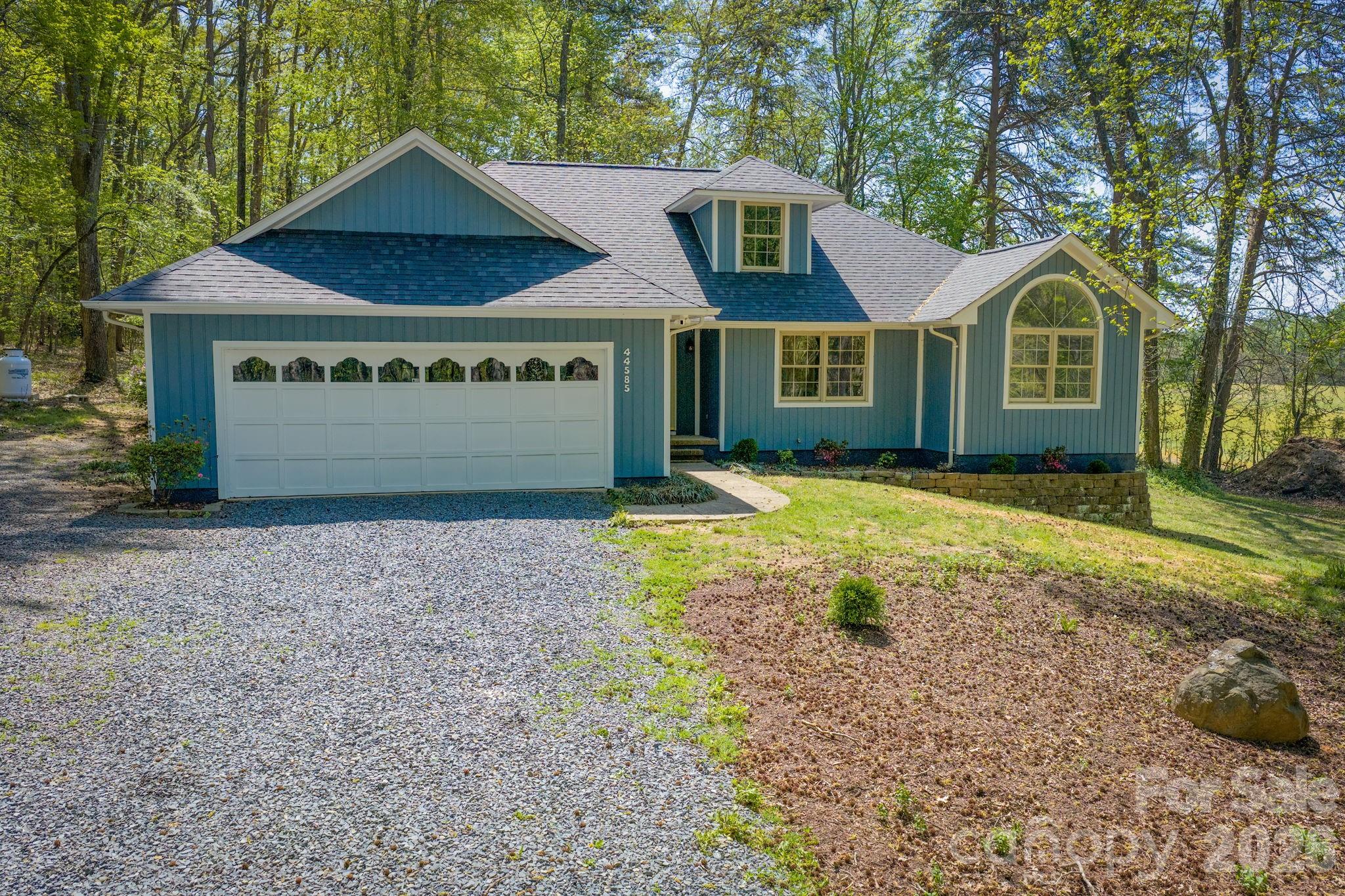 Discover comfort, privacy, and modern updates at 44585 Baldwin Road, a move-in-ready home set on 2.5 wooded acres in New London. Renovated in 2025, this property features a brand new roof (March 2026), new LVP flooring, updated lighting and plumbing fixtures, fresh interior paint, and new outlets and switches throughout. The main living area includes a stone-surround gas log fireplace with a custom walnut mantle and opens to a flexible office or dining space. The updated kitchen offers granite countertops, soft-return dovetail cabinets, all-new GE stainless appliances, a pull-out sprayer sink faucet, and a custom-built movable butcher-block island. A breakfast nook and dining area complete the main level living space.

The main-level primary suite includes a walk-in closet and a renovated bath with a French door entrance, freestanding soaking tub, granite vanity, and separate shower. Two additional bedrooms feature large windows and wall closets. The refreshed full bath adds comfort and convenience for family or guests. The upstairs bonus room offers versatile space ideal for a playroom, home office, media area, or future expansion. Outdoors, enjoy a two-level deck, gazebo, and newly painted siding. Additional improvements include a 2023 HVAC system, 2021 water heater, updated plumbing and electrical, a new vapor barrier, and a security camera. Located close to Albemarle, Badin Lake, and Uwharrie National Forest, with convenient access to Charlotte for work, travel, or city amenities.