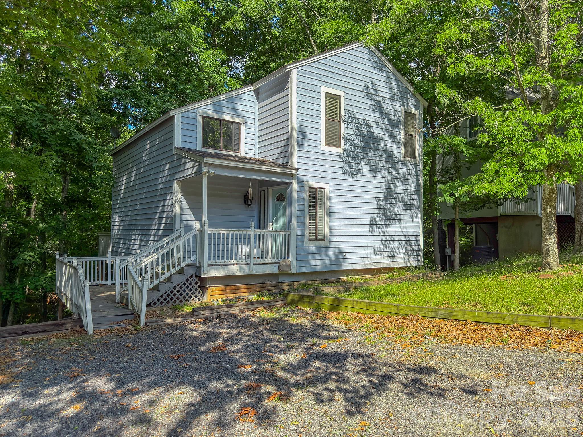 Come check out this great property in the sought after Tega Cay neighborhood. This 2 bedroom, 1.5 bath single family home is ready for your vision and is packed with potential. The home features a large back deck overlooking a private natural setting, a waterfall countertop in the kitchen, and updated lighting. This home could make a great flip, rental, or renovation project for someone looking to move right by Lake Wylie. This home is priced under the tax assessed value so don’t sit on it too long!