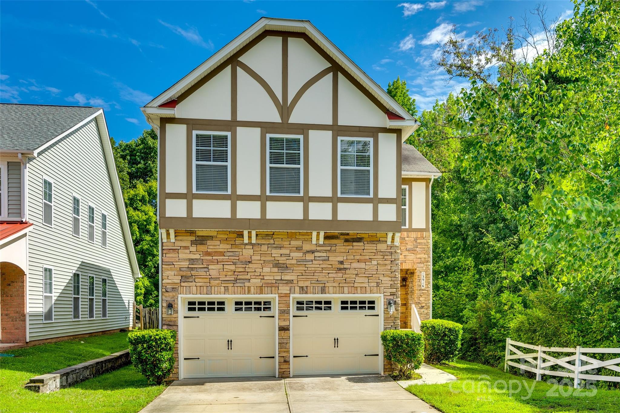 VA Loan is assumable at 3.75% rate for qualified buyers. This move-in ready Tudor style home has a new dehumidifier and encapsulated crawl space, new HVAC system, and new tankless water heater. Ideal flow floor plan with tall ceilings throughout. Large eat in kitchen with peninsula island that opens to the living room. 3 bedrooms, including the owner's suite with a tray ceiling, plus loft space upstairs. Close to entertainment, shopping, highway access, PNC arena and Speedway.