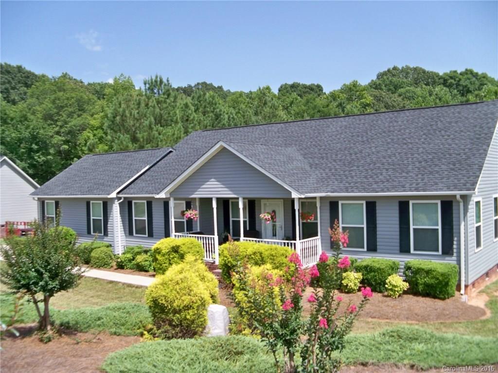 WOW--If you are looking for a wonderful, open floor plan Ranch--in peaceful country setting--THIS IS IT!! Home has been meticulously maintained and shows like a model.   Dining, great room, and kitchen are all open making for a great home for entertaining.  The rocking chair front porch looks over a extensively landscaped front yard.  Back yard extends into peaceful wooded area with plenty of space for pool/ gardening.  Country but close to CLT airport/shopping/dining. OH YEAH- CLOVER SCHOOLS !!