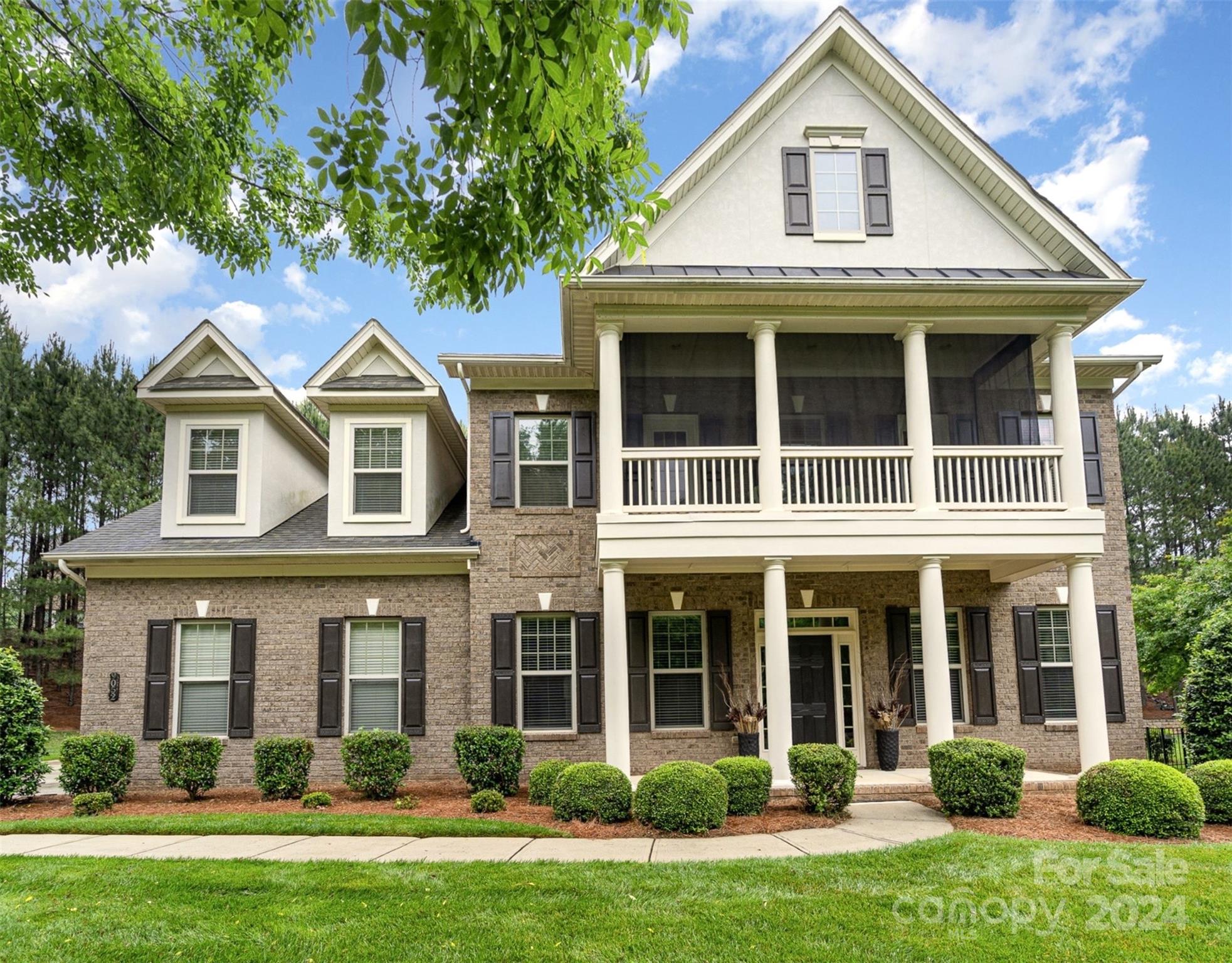 Welcome to your dream home in the desirable Barber Rock neighborhood of Indian Land, SC! This stunning full brick, 2-story home is freshly painted white throughout. As you approach, you'll be charmed by the covered front porch and the upper balcony. Step inside to discover an open layout with a spacious kitchen, featuring granite countertops, a large island for prep and seating, a gas cooktop, and stainless steel appliances.  You'll love the dedicated office space, ideal for remote work or study. Gorgeous screened-in porch with a stone fireplace and outdoor kitchen, overlooking a private backyard. Situated on a cul-de-sac lot, this home boasts a well-manicured lawn and is surrounded by trees, offering full privacy. Fantastic amenities include an outdoor pool, playground, and clubhouse. Plus, you'll be centrally located between Fort Mill and Ballantyne, close to a variety of dining and shopping options. Don't miss out on this beautiful home. Schedule a showing today and make it yours!