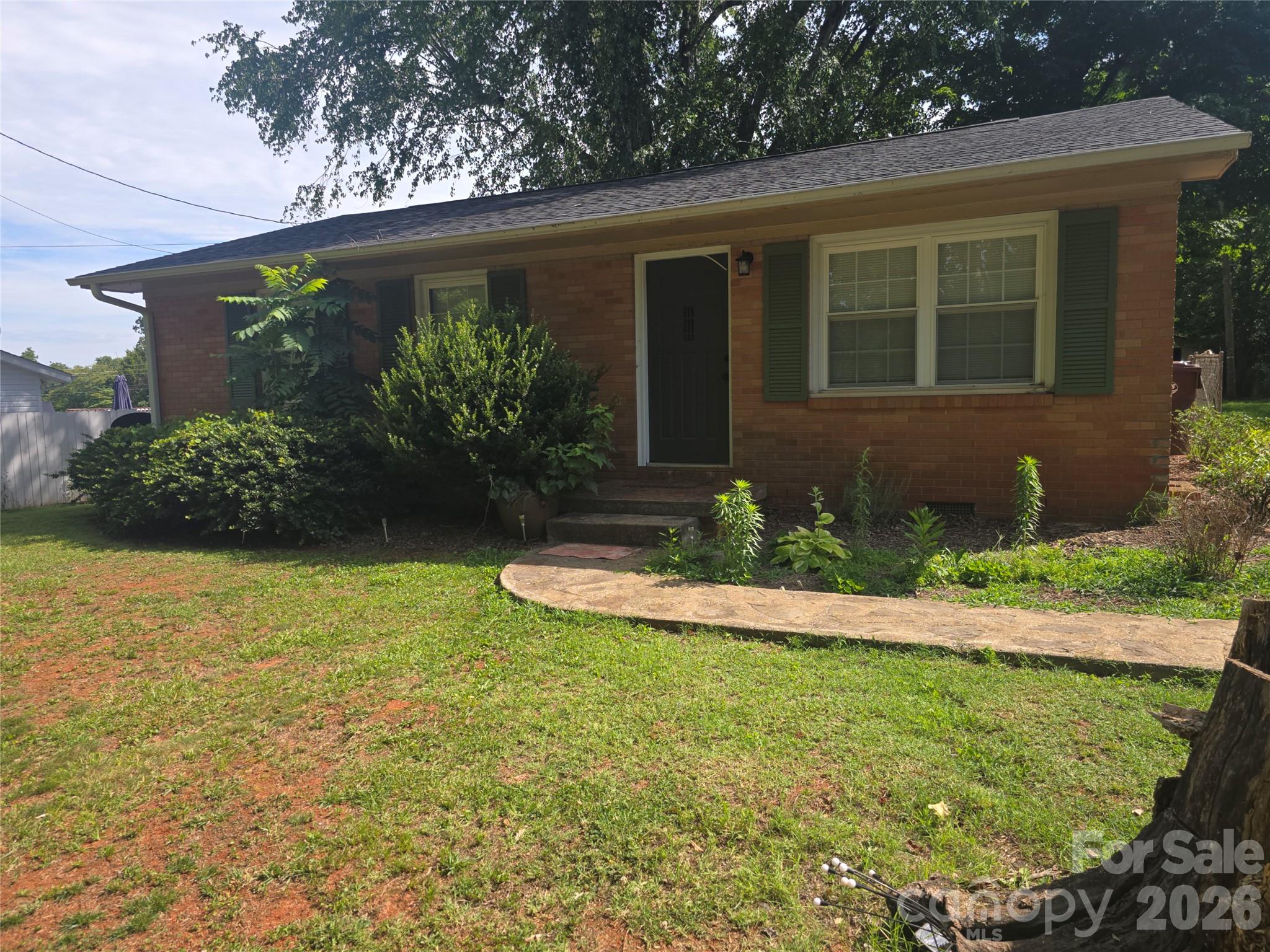 Welcome home to this charming all-brick ranch nestled in the quaint and established Northview Park neighborhood of Rutherfordton. Offering 3 bedrooms, 1 bathroom, and nearly 1,000 square feet of comfortable living space, this move-in-ready home combines timeless character with valuable updates, making it an excellent choice for first-time homebuyers, downsizers, investors, or anyone looking for low-maintenance living. 
Inside, you'll find beautifully refinished hardwood floors that add warmth and charm throughout much of the home. The spacious living area flows into a bright kitchen featuring all newer appliances, providing a functional space for everyday living and entertaining. A large laundry/mud room offers additional storage and flexibility and could easily be converted into a primary bathroom, creating the potential for a true primary suite.

Major updates have already been completed for added peace of mind, including a new roof installed in 2020, a new water heater in 2021, refinished hardwood floors, and updated kitchen appliances. The home is served by city water, septic, central heating and air, and includes a detached one-car garage with additional driveway parking.

Step outside to enjoy the level, fenced backyard, offering plenty of room for pets, gardening, outdoor entertaining, or simply relaxing around the fire pit. The property also includes a storage building, providing extra space for tools, lawn equipment, or hobbies.
Location is everything, and this home delivers. Situated in a quiet, established neighborhood, you'll enjoy the convenience of being approximately 6 minutes from Rutherford Regional Medical Center, about 20 minutes to the Tryon International Equestrian Center, and just 20 minutes from the beautiful waters, restaurants, and outdoor recreation of Lake Lure. Shopping, dining, schools, and everyday conveniences are all just minutes away.
For commuters and travelers, the property is ideally positioned between Asheville Regional Airport and Charlotte Douglas International Airport, making business travel and weekend getaways incredibly convenient while still allowing you to enjoy the peaceful atmosphere of small-town living.
Previously used as a successful rental property, this home also presents an excellent investment opportunity with owner-occupant or rental income potential. Whether you're searching for your first home, your next investment, or a place to simplify your lifestyle without sacrificing convenience, this Rutherfordton gem is one you won't want to miss. Schedule your private showing today and discover everything this inviting home has to offer!  Still  waiting on the professional photos to upload, will do AS SOON AS we have them.