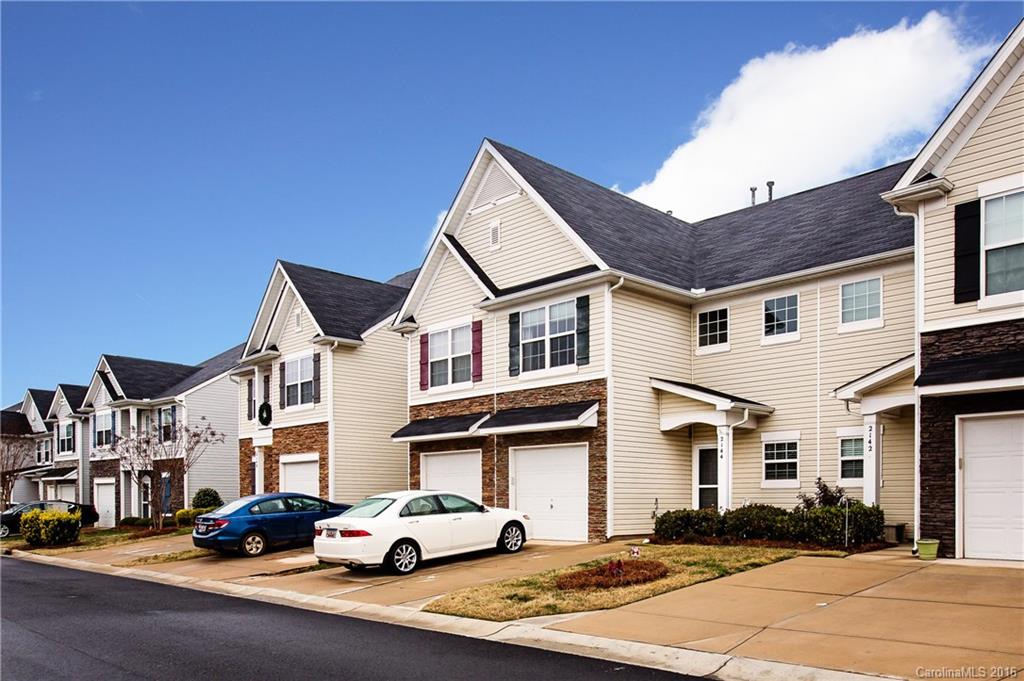 Awesome Location in the Heart of Lake Wylie w/Easy Living! Welcome to 2144 Shady Pond Dr. Clover, SC. This 2 Story Townhome offers an Open Floorplan w/5” Faux HW flooring on the main, Granite C-Tops, Eat-in Kitchen & Spacious Fam. RM. 2nd floor has 3BR’s, 2.5 BA’s & is convenient to the Laundry Area. Park in the Attached Garage or use this space for added storage.  Enjoy an evening grilling on the Fenced- in Patio which offers privacy for entertaining. Minutes from Charlotte & Lake Wylie Fun.