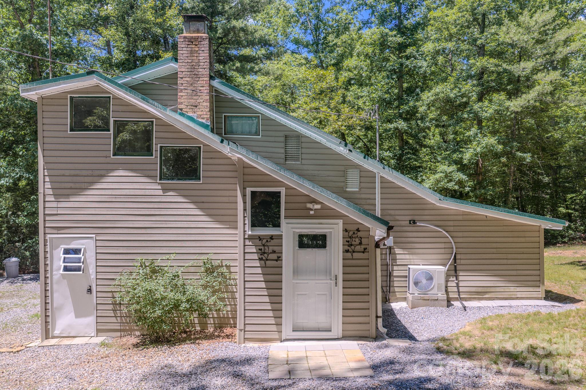 8 Acres Bordering Protected Forest Land | 4 Min to Fonta Flora County Park and Connector Trailhead.
Rare private retreat on 8 wooded acres in the Lake James corridor of Western North Carolina. County property card reflects 1 bedroom; property features 2 additional flex/bonus rooms suitable for sleeping. Backs directly to protected forest land with plenty of level, usable acreage. Newly updated kitchen with new cabinets, appliances, countertops, and flooring. Brand-new mini split and doors. Spectrum Internet available.
Just 4 minutes to Fonta Flora County Trailhead to enjoy some of Western North Carolina's best hiking, biking, and lake access with panoramic mountain views of Lake James.
Perfect as a primary residence, vacation home, Airbnb investment, weekend getaway, or summer lake retreat. Boat storage shed and outbuildings available for purchase. Can be sold furnished.
County property card reflects 1 bedroom. Two main-level bonus rooms have sloped ceilings and are not included in heated living area. No septic record on file with county.