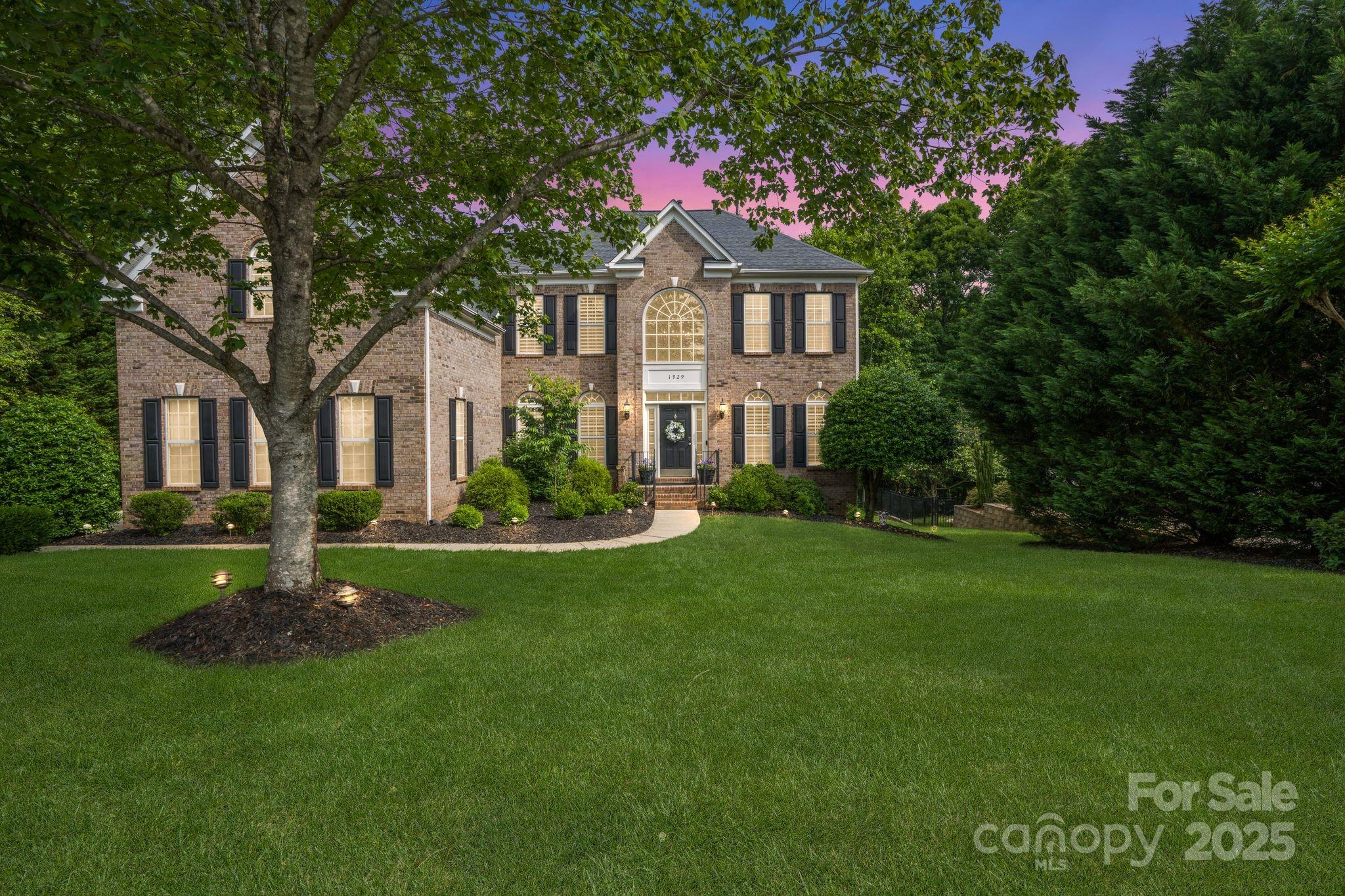 Welcome to this elegantly modernized home, thoughtfully designed across three levels. This 4-bedroom, 3.5-bath residence offers the perfect blend of work-from-home flexibility and family-friendly living. Step inside to soaring ceilings, newly refinished hardwood floors, and abundant natural light. The gourmet kitchen impresses with stainless steel appliances, granite countertops, a spacious island, and a walk-in pantry. The oversized primary suite is a true retreat, featuring tray ceilings, generous walk-in closets, and a spa-like bath. The expansive finished basement offers multiple flex rooms, a cozy fireplace, and a dedicated home theater—ideal for entertaining, fitness, or guest accommodations. Outside, enjoy a private backyard oasis with fireplace & fire pit. With top-rated Fort Mill schools, convenient access to a neighborhood pool, playground, and sports court, and nearby trails, shopping, and dining, this home invites you to live the lifestyle you’ve always dreamed of.