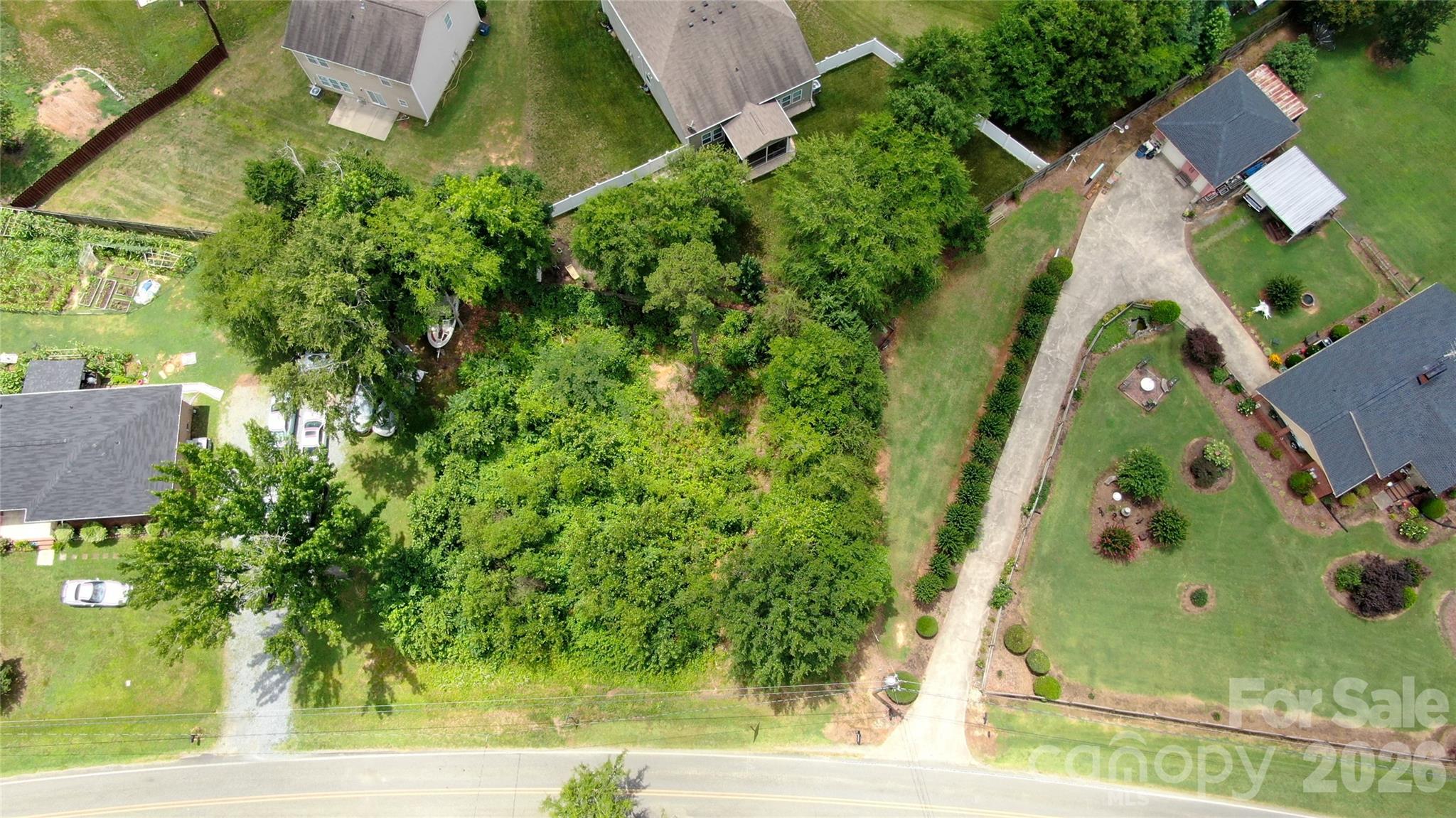 Discover the opportunity to build in one of Charlotte’s fast-growing northwest corridors! This wide frontage lot offers the perfect blend of privacy, accessibility, and convenience—ideal for a custom home, investment project, or future development.

Nestled in an established area of Northwest Charlotte, this property provides quick access to many of the city’s most desirable destinations:

Approx. 15–20 minutes to Charlotte Douglas International Airport.
Approx. 15 minutes to Uptown Charlotte (banking, dining, sports, entertainment) Uptown Charlotte.
Approx. 15–20 minutes to Northlake Mall for shopping, restaurants, and retail.
Convenient access to major highways including Interstate 485, Interstate 85, and Interstate 77, making commuting around Charlotte easy.
Near outdoor recreation, parks, and the scenic Mountain Island Lake area for boating, fishing, and nature escapes and the U.S. National Whitewater Center. 

This area continues to see strong residential growth and redevelopment, making this lot especially attractive for buyers seeking land in a location with long-term upside. Enjoy the feel of a quieter residential setting while remaining close to everything Charlotte has to offer.

Bring your vision and build your future here! Opportunities for land in this location are becoming harder to find.