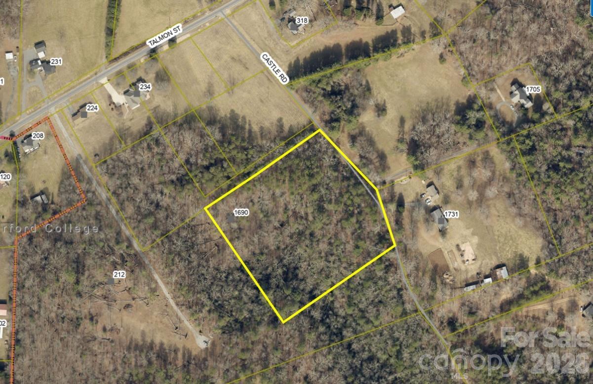 5+ Acres located on a private paved road less than 2 miles from Castle Bridge Boat Access. NO CITY TAXES. Property is located outside Rutherford College City Limits. Public water is available. Septic required. There is an old dwelling with no value and not livable on the property. Come build your dream home here.