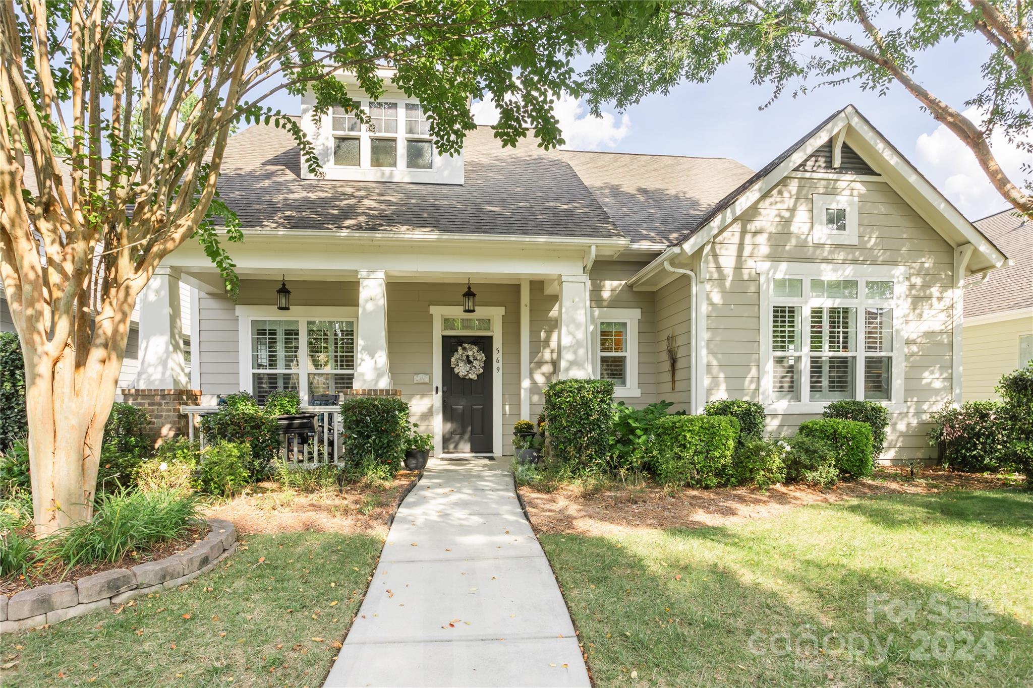 HUGE PRICE IMPROVEMENT! This spacious residence blends luxury and comfort. Nestled in a peaceful community with over 2400 sq ft, this 3 bedroom, 2.5 bathroom home features many high-end finishes such as 10' ceilings on the first floor, and plantation shutters throughout. The primary suite has a stunning cathedral ceiling with wood beams, bathroom has dual sink vanity, tiled shower, seperate water closet, and walk-in closet with built-ins. The gourmet kitchen boasts an abundace of custom cabinetry, oversized granite island, double oven/microwave combo, gas cooktop with a vented hood. The office has glass French doors. Upstairs you will find two bedrooms, a full bath, and a spacious loft area. Heavy trim work adds elegance around the home. Cozy up by the gas fireplace in the living area or enjoy the tranquility of the screened porch with private wooded views. The oversized garage also provides tons of extra storage. Don’t miss out on the chance to own this exquisite property!