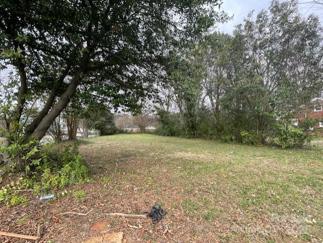 Single Family lot available to build your dream home in this great location. This lot is a wide corner lot, flat and symmetrical for the perfect placement of a single family home. There are some trees included as well to provide a great back drop for your new backyard! It is close to so many retail shops and restaurants and a quick 7 minute commute to Downtown Charlotte!