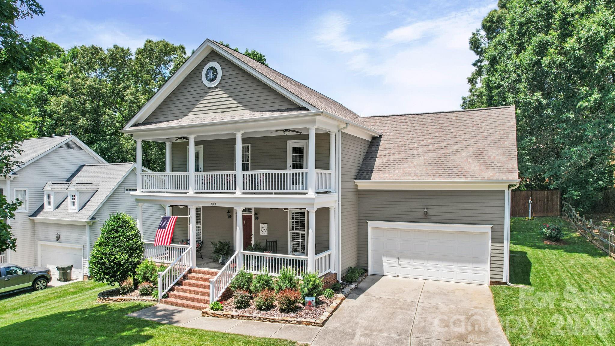 No HOA! Welcome to this beautifully maintained two-story home offering outstanding curb appeal, inviting living spaces, and a thoughtfully designed floor plan located in The Oaks on Providence. A charming covered front porch and upper-level balcony create a welcoming first impression, while enhancing the home's attractive exterior. This home features 3 Bedrooms, Bonus Room, 2 Full Bathrooms and 2 Half Bathrooms.  This Charleston Style home has approximately 2710 heated square feet. The main level features hardwood flooring throughout the living areas, a formal dining room, a comfortable living room, and a spacious great room with a fireplace that opens seamlessly to the kitchen and breakfast area, creating an ideal layout for everyday living and entertaining. The kitchen offers granite countertops, stainless steel appliances, abundant cabinetry, a breakfast bar, tile backsplash, pantry storage, and generous workspace. The adjoining breakfast area overlooks the backyard and provides access to the outdoor living space. The primary suite serves as a relaxing retreat and features a spacious bedroom, a walk-in closet, and an updated primary bath with dual vanities, a large tiled walk-in shower. Additional bedrooms are generously sized and provide flexibility for family, guests, or home office space. A large bonus room offers endless possibilities as a bedroom, media room, playroom, recreation room, or additional living area. Outdoor living is equally impressive with a covered front porch, covered front balcony, rear patio and nice backyard offering plenty of room for outdoor enjoyment, entertaining, or recreation. Additional features include neutral décor throughout, attractive millwork, ample storage and an attached two car garage. This well-maintained home combines comfort, functionality, and timeless appeal in a setting convenient to shopping, dining, schools, and everyday amenities.  Please schedule your appointment to view this wonderful home today!