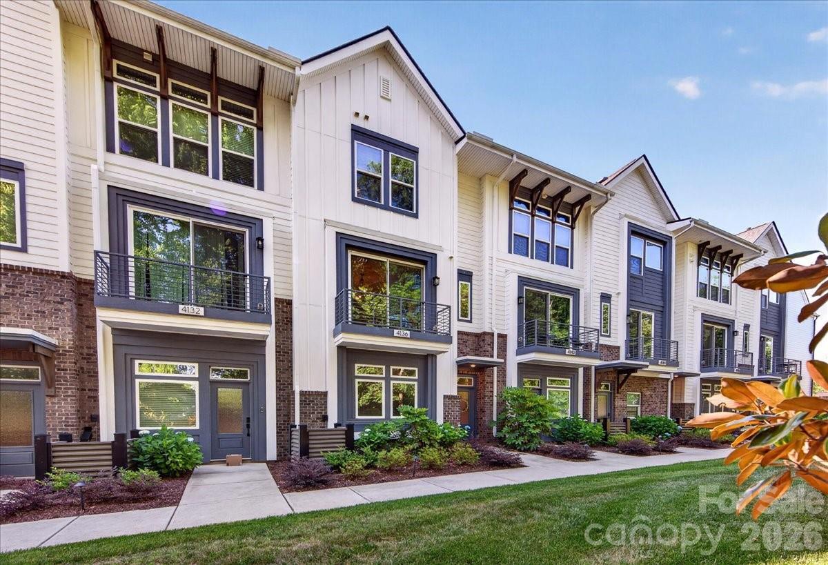 Tucked into a lush, tree-lined setting in one of Charlotte's most beloved and evolving neighborhoods, this spacious 4-story Cotswold townhome offers something truly rare: every bedroom has its own private en-suite bath & walk-in closet. Whether hosting guests or accommodating a growing household, privacy & comfort are built into every floor. The main living level impresses with rich hardwood floors & an open-concept layout centered around a stunning kitchen featuring white 42" cabinetry, quartz countertops, a farmhouse sink, SS gas range, under-cabinet lighting, & a walk-in pantry. Step out onto your private balcony/deck overlooking serene green space, perfect for morning coffee or an evening cocktail. Every bathroom carries the same elevated finish level with quartz counters, white cabinets, & tiled shower surrounds. The lower level welcomes guests with a private suite complete with LVP flooring, full bath, & walk-in closet. Ascend to your rooftop terrace (over 18 feet wide & 11 feet deep) for the ultimate entertaining space above the treetops. Tech-forward touches include prewired CAT5 Ethernet throughout & an Eero Wireless Mesh System on each floor. A 2-car garage with Level 2 Hardwired EV Charging Station plus two additional parking spaces complete the package. Talk about LOCATION?! You're just 0.2 miles from Charlotte Swim & Racquet Club, 1.7 miles from shopping & restaurants at Cotswold Village, under 4 miles from South Park & Plaza Midwood, and only 6.5 miles from Uptown. HOA covers water, sewer, trash, and landscaping, allowing you to spend less time on maintenance & more time enjoying everything Charlotte has to offer!