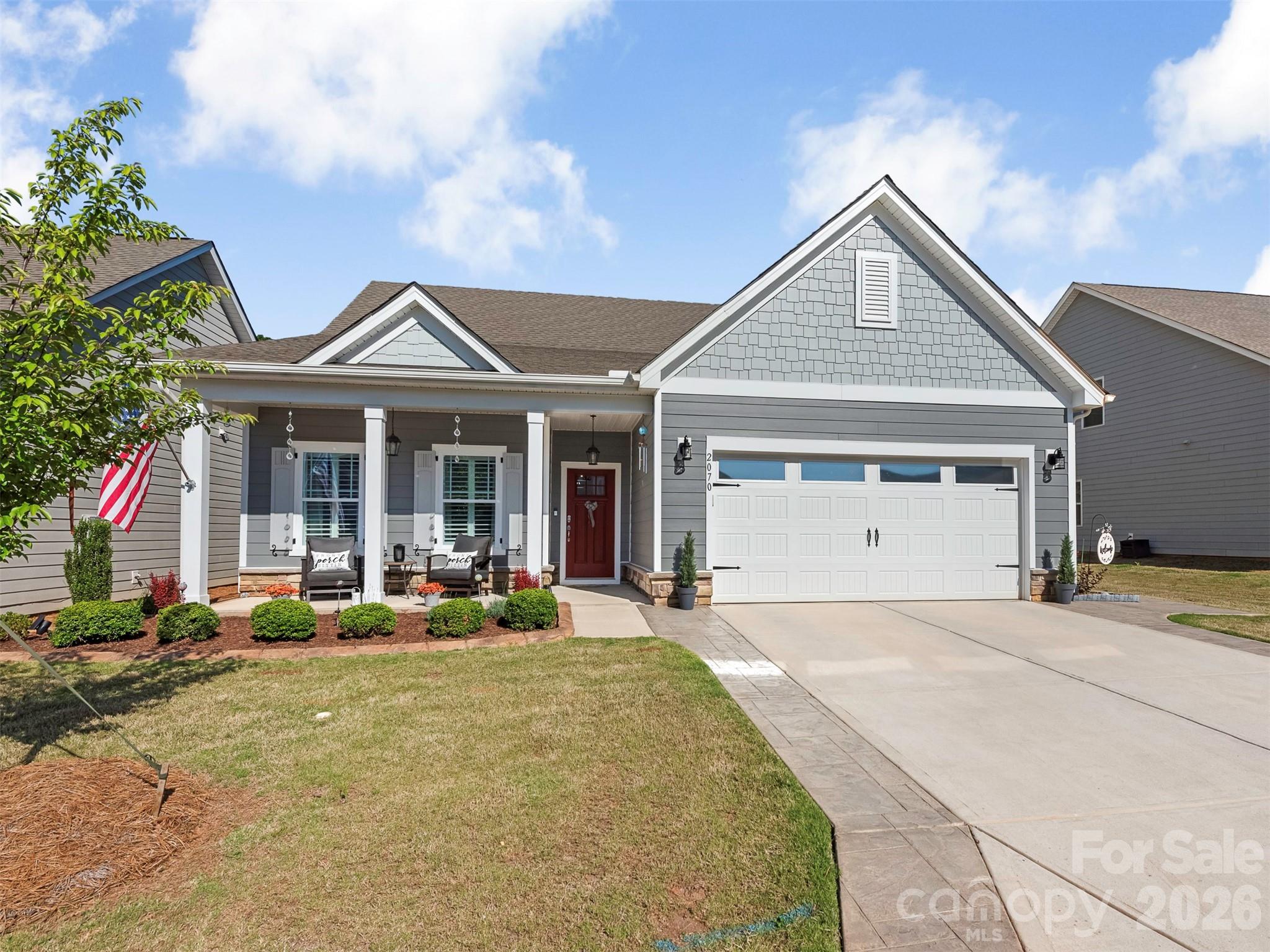 AMAZING Upgrades in this one!!!! 55+ community, just minutes from Downtown Fort Mill and steps from the Fort Mill Golf Club. Located on a cul-de-sac street, this beautifully designed open floor plan offers exceptional flexibility with main level living plus multiple flex spaces to fit your lifestyle.
Upstairs, you’ll find a spacious bonus room that can easily serve as a a bedroom, media room, or hobby space, along with over 300 square feet of unfinished storage that could easily be converted into an additional room.
The gourmet kitchen is the heart of the home, featuring quartz countertops, an expanded center island with a microwave drawer, and a 2025 upgraded 5-burner gas stove. The expansive family room and dining area create an effortless flow for entertaining. A formal dining room with French doors and a closet offers even more versatility and could easily function as a private office or additional bedroom.
The spacious primary suite offers a peaceful retreat with a beautifully designed en-suite bath featuring a large walk-in shower, double vanity, and expansive walk-in closet. Enjoy year-round relaxation in the THREE SEASON room with EZ Breeze windows, heated and cooled for added comfort. The expanded back patio offers both a large covered area and space to dine under the stars, all overlooking thoughtfully landscaped features that create a peaceful outdoor retreat.
Luxury vinyl plank flooring throughout the main level, heavy molding, shutters, and elegant board and batten details add warmth and sophistication throughout the home. The well-appointed laundry room includes built-in cabinetry and ample workspace, while the OVERSIZED two-car garage measures 19.5 x 26 and showcases an epoxy floor with additional storage. Home is STEEL constructed with foam in place insulation. An expanded driveway and custom walkway leading to the backyard reflect the attention to detail and care that make this home truly move-in ready. Fully maintained landscaping and in-ground irrigation provide extra time to enjoy nearby shopping, restaurants, and all the conveniences of the area.