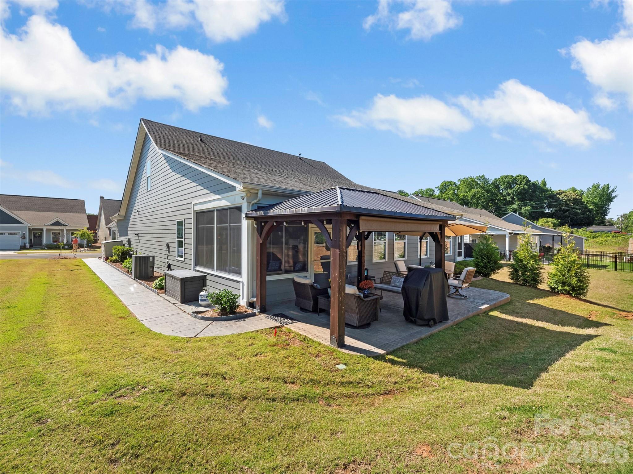 Travel with no worries, entertain easily, space for the family!!!  AMAZING Upgrades in this one! 55+ community, just minutes from Downtown Fort Mill and steps from the Fort Mill Golf Club. Located on a cul-de-sac street, this beautifully designed open floor plan offers exceptional flexibility with main level living plus multiple flex spaces to fit your lifestyle.
Upstairs, you’ll find a spacious bonus room that can easily serve as a a bedroom, media room, or hobby space, along with over 300 square feet of unfinished storage that could easily be converted into an additional room.
The gourmet kitchen is the heart of the home, featuring quartz countertops, an expanded center island with a microwave drawer, and a 2025 upgraded 5-burner gas stove. The expansive family room and dining area create an effortless flow for entertaining. A formal dining room with French doors and a closet offers even more versatility and could easily function as a private office or additional bedroom.
The spacious primary suite offers a peaceful retreat with a beautifully designed en-suite bath featuring a large walk-in shower, double vanity, and expansive walk-in closet. Enjoy year-round relaxation in the THREE SEASON room with EZ Breeze windows, heated and cooled for added comfort. The expanded back patio offers both a large covered area and space to dine under the stars, all overlooking thoughtfully landscaped features that create a peaceful outdoor retreat.
Luxury vinyl plank flooring throughout the main level, heavy molding, shutters, and elegant board and batten details add warmth and sophistication throughout the home. The well-appointed laundry room includes built-in cabinetry and ample workspace, while the OVERSIZED two-car garage measures 19.5 x 26 and showcases an epoxy floor with additional storage. Home is STEEL constructed with foam in place insulation. An expanded driveway and custom walkway leading to the backyard reflect the attention to detail and care that make this home truly move-in ready. Fully maintained landscaping and in-ground irrigation provide extra time to enjoy nearby shopping, restaurants, and all the conveniences of the area.