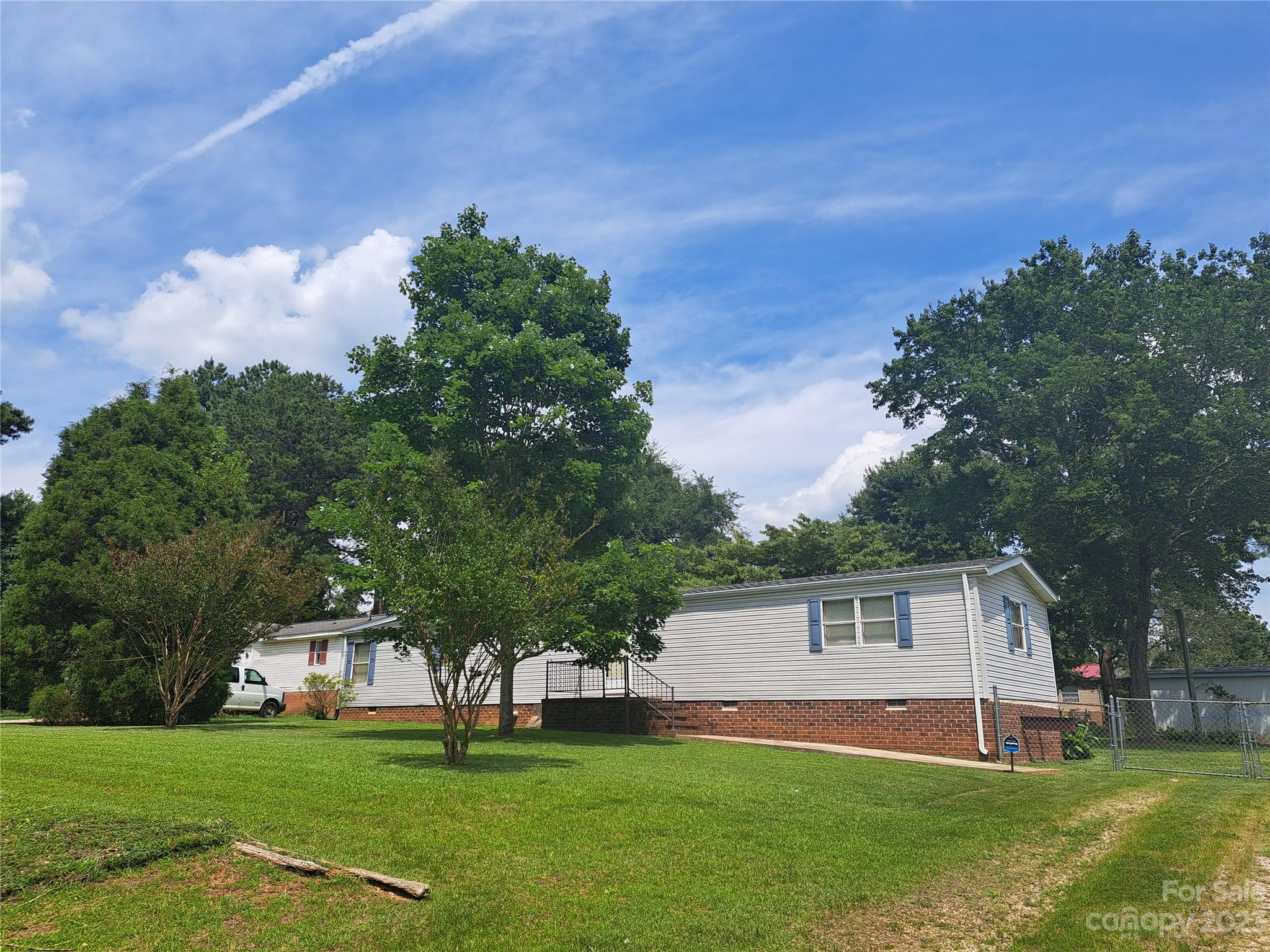 Welcome to this charming single-wide mobile home located in the heart of Salisbury, NC! Nestled within an established Westwood subdivision, this lovely residence offers comfortable living with two bedrooms, one bathroom, a fenced yard, and a convenient storage building. The open floor plan seamlessly connects the living room, dining area, and kitchen. The two bedrooms provide a peaceful retreat for rest and relaxation. 
One of the standout features of this property is the fully fenced yard, providing privacy for you, your family, and your pets. Imagine enjoying a morning coffee on the back porch or hosting outdoor gatherings in this delightful space. Situated in a prime location, this mobile home is just minutes away from I85, offering easy access to major highways and making commuting a breeze. You'll also appreciate the close proximity to a variety of shopping options, ensuring all your retail needs are met conveniently. The seller will not do any repairs! Sells as is.