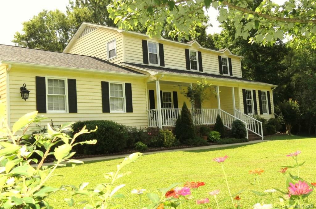Charming home on corner lot in established neighborhood! Rocking chair front porch, hardwoods, tile floors, wood burning fireplace, formal living and dining room, updated kitchen and bathrooms, office/bonus on upper level, NEW Roof, deck overlooks private fenced backyard. Home warranty included! Close to I-77 and shopping!