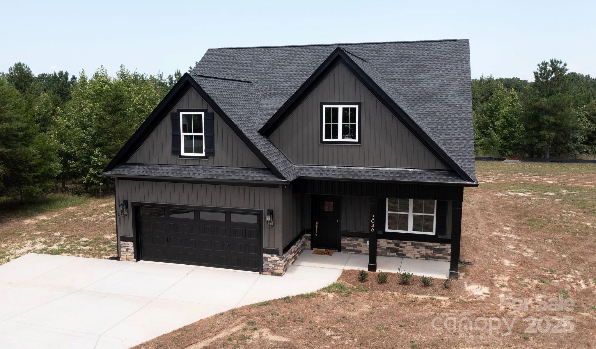 Step into your dream home on this spacious 1.27-acre lot in the beautiful Stonecrest Meadows community. This home offers a prime location with excellent curb appeal. Enjoy the privacy of a large lot while still being part of a thoughtfully planned development. Featuring a large kitchen and living area, this home is great for everyday meals or entertaining guests. The main level primary suite is a standout feature, offering a private ensuite bathroom. A unique feature is the direct access from the primary bathroom into the laundry room, adding everyday convenience and making household tasks a breeze. Completing the main floor, a convenient half bath for guests and a spacious dinning room. Upstairs you'll find three additional bedrooms and a full bathroom, idea for family, guests, or flexible spaces such as an office or playroom. Outside, enjoy a screened in covered back porch with a full acre of land for outdoor seating, gardening, or play. Located just 15 minutes from downtown York. Clover address but York school districts. Tankless gas hot water heater and high energy-efficient heat pump (14 seer rating). Comes pre-wired for easy access to Comporium and AT&T high-speed Internet. Enjoy the cost-saving benefit of water from a private well, eliminating expensive water bills, as well as no sewer bills to pay! Don't miss your chance to make this wonderful property your own, schedule a showing today!