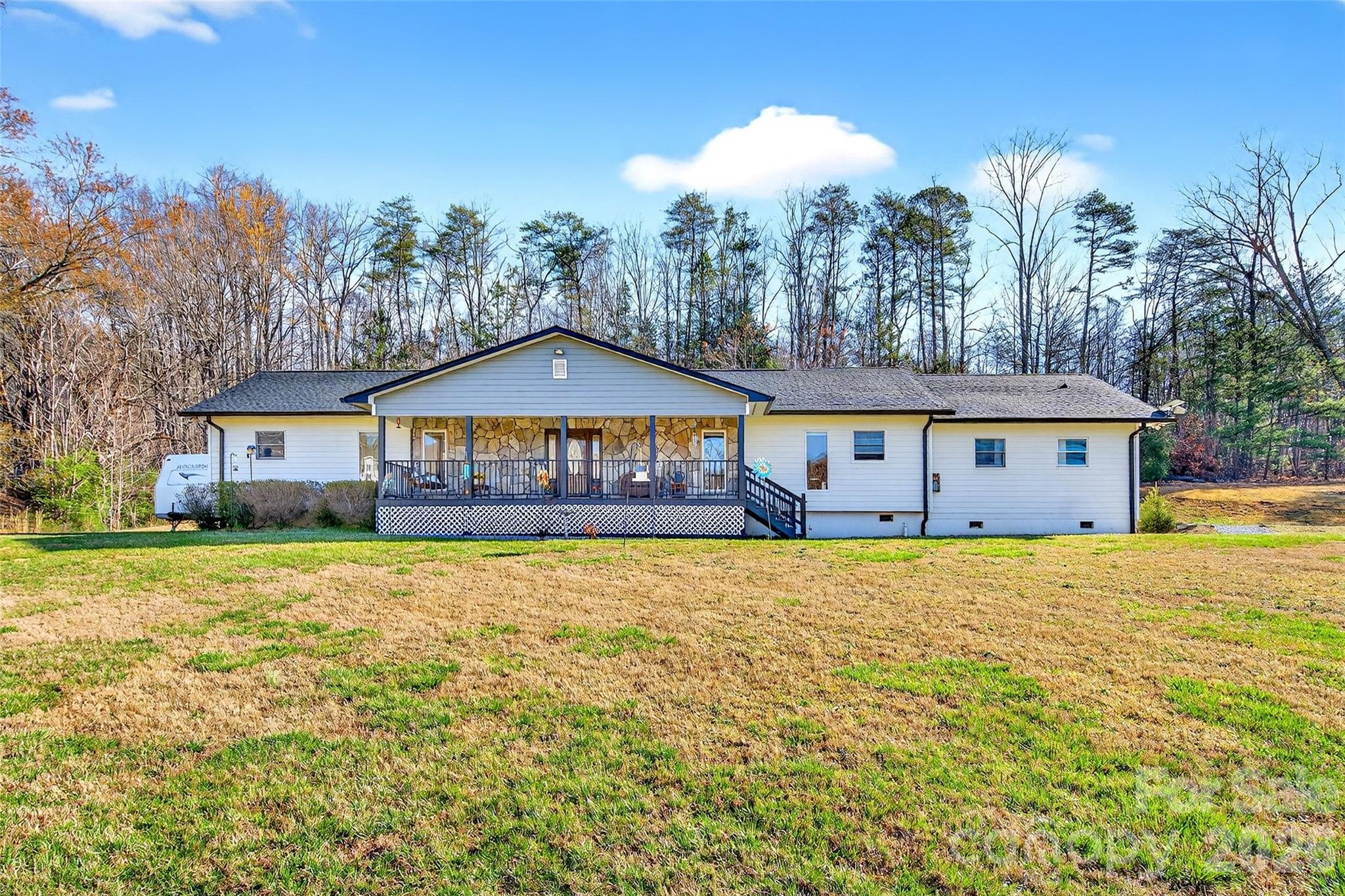 Must see to appreciate this expansive Living room and Kitchen area!  Nestled in the scenic foothills of Western North Carolina, this stunning 3-bedroom, 3-bathroom home delivers an impressive 2,553 square feet of thoughtfully designed living space — and that's just the beginning. Step outside and discover a generously sized lot that gives you room to breathe, garden, play, or simply soak in the fresh mountain air.

Inside, the baker's dream kitchen steals the show with an abundance of cabinet storage and countertop space that could make even the most ambitious pastry chef weep with joy. Two primary bedrooms each boast their own expansive bathrooms, offering a level of comfort and privacy that feels downright luxurious. The spacious third bedroom accommodates family or guests with ease.

But wait — there's more. A versatile bonus room awaits your vision, whether that's a home office, game room, reading nook, or dedicated classroom. The oversized laundry room keeps household chores manageable, while the heated garage provides space for your vehicle and a workshop area for those weekend projects.

Step onto the lovely covered front porch and take in the view of your beautifully maintained lawn. The outdoor space here truly sets this property apart, offering endless possibilities for outdoor living and entertaining.

Location is everything, and this home delivers with a quick five-minute drive to Interstate 40 and just twenty-five minutes to the vibrant city of Asheville and a quick 10 minute trip to Downtown Marion.

This one won't last long. Schedule your private showing today and see what home really feels like.