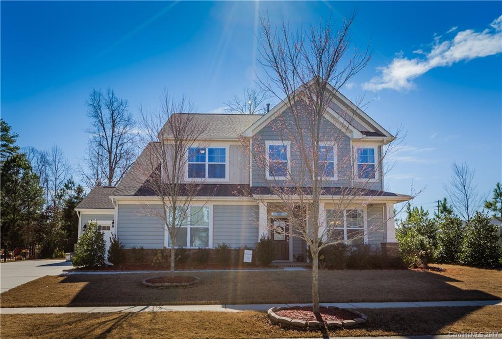 MUST SEE-shows like a model, in desirable Reserve community w/Fort Mill schools & taxes. 3 car garage, fenced yard w/covered patio, irrigation. Gorgeous hardwoods & detailed moldings throughout main. Bright kitchen w/oversized pantry & island. Gas stove, over & under cabinet lighting, granite & subway tile. Well maintained, open & full of natural light. Flex room on main floor. Upstairs laundry, generous closets, luxurious master & upgraded bath. Loft could easily be converted to 4th bedroom.
