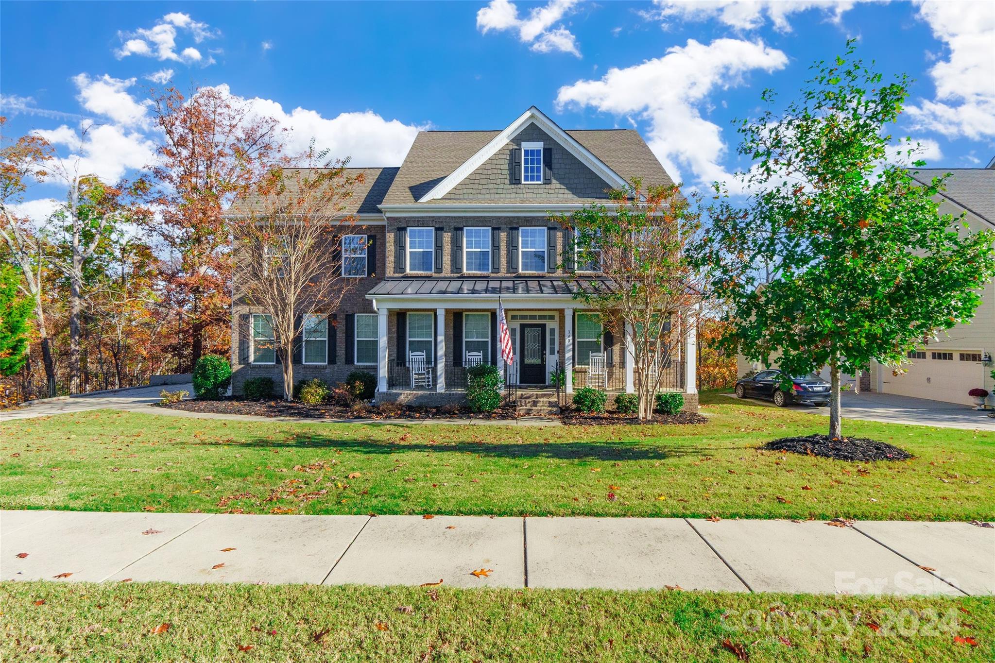This stunning 5 BD / 5 BA home exudes curb appeal with its welcoming covered front entry porch. As you enter, you’ll be greeted by prefinished hardwood floors that flow through the main living areas. The gourmet kitchen is a dream, with a pantry, SS appliances, an island & double oven. The formal dining room is adorned with wainscoting & the great room features a cozy gas log fireplace. A convenient bedroom & full bath are located on the main level. Upstairs, the owner’s suite boasts a generous walk-in closet, while a loft provides additional space. Two more bedrooms, each with its own full bath, complete the upper level. The 3rd level offers a private 5th bedroom, a full bath & a bonus room. Need more room? The basement is ready for customization, with plumbing in place for a bathroom or wet bar. Outside, a spacious deck overlooks the woods, providing a retreat. Located in the desirable Serenity Point waterfront community in Tega Cay, this home offers an unmatched living experience!
