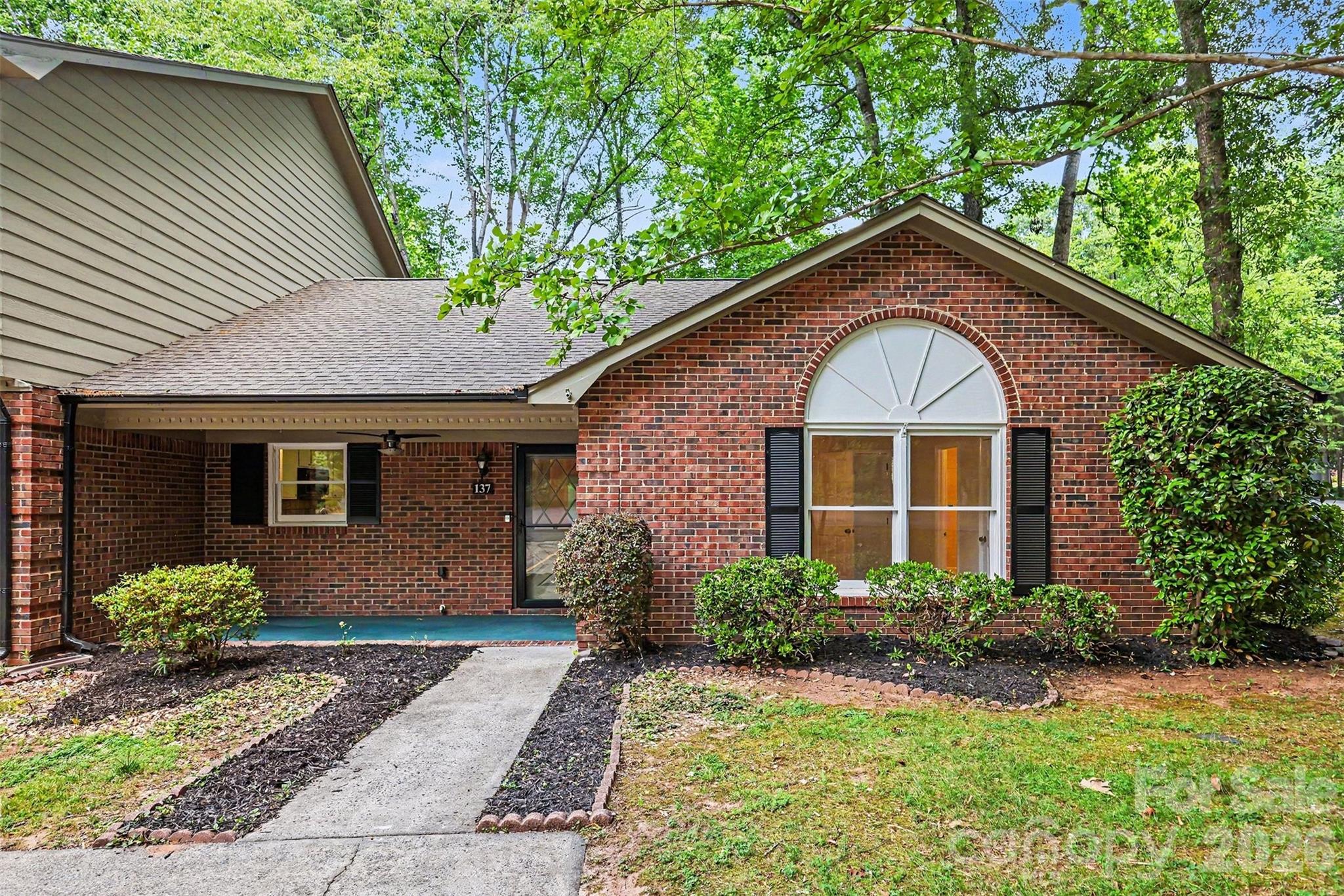 Welcome home to 137 Phil Court! Nestled in the quiet and established Ashebrook Villas of Fort Mill, this charming 1,200+ sq. ft. end-unit ranch offers single-level living at its finest. Whether you are a first-time homebuyer, looking to downsize, or seeking a prime investment, this property perfectly balances comfort, value, and unmatched location.

Key Features
- Open & Bright Layout: Step into a flowing, open-concept floor plan designed for effortless living. The living area is highlighted by an open sunroom, welcoming centerpiece for relaxing evenings.
- Private Outdoor Retreat: As an end unit, this home features a serene, tree-lined, wooded backyard. Enjoy your morning coffee or a quiet evening on the back deck while taking in the natural, quiet surroundings.
- Comfortable Bedrooms: Two generously sized bedrooms and two full bathrooms provide plenty of space, flexibility, and privacy for residents and guests alike.
- Paint and carpet done April 2026

Location & Lifestyle
- Top-Rated Schools: Located in the highly sought-after Fort Mill School District, with Fort Mill Elementary and Fort Mill Middle located just under a mile away.
- Ultimate Convenience: Situated less than 10 minutes from I-77, providing a quick and easy commute to Uptown Charlotte.
- Local Amenities: Enjoy access to the community pool and take advantage of the shopping and dining options along Hwy 160. The beautiful green spaces of the Anne Springs Close Greenway are just a short drive away.

Sunroom is open to the main living space and is not calculated in the HLA.