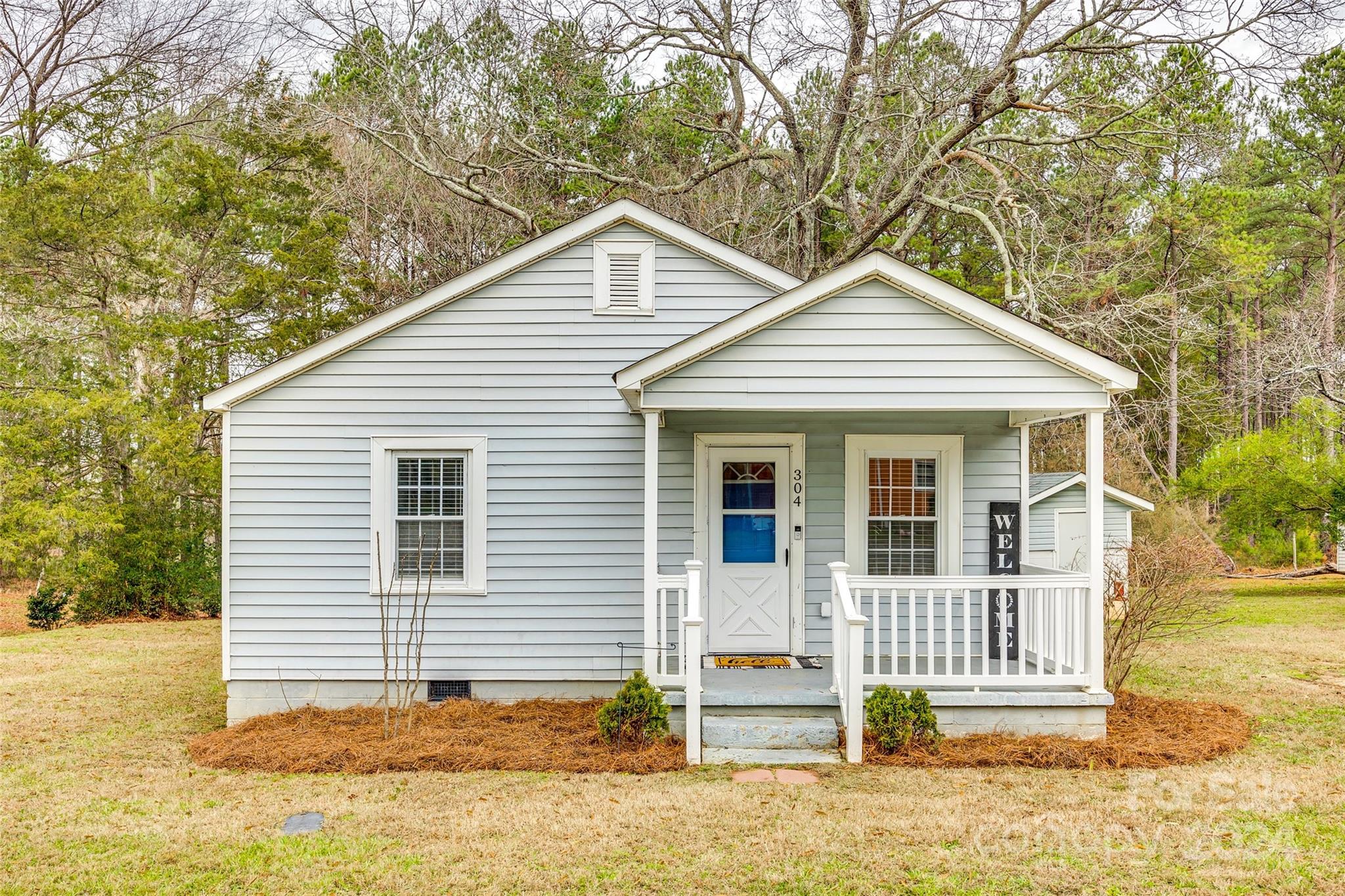 Adorable bungalow just minutes from downtown Stanley! Hardwood floors & molding keep the cozy charm, while the generously sized kitchen is full of updates - upgraded granite, soft close cabinets & drawers, dishwasher, sink, & microwave were all new in 2020 when Sellers purchased the home! The large peninsula offers plenty of room for seating and a perfect flow between spaces for entertaining! HVAC was replaced in 2016, and the Refrigerator, Washer, & Dryer will all convey for easy move-in! Enjoy relaxing on the covered front porch, or head to the back deck (with a sail for added shade!) that overlooks your spacious, peaceful, tree-lined back yard. Storage shed w/ power has built-in shelving, & the yard space in front offers plenty of room to add a driveway. First-time buyer? Investor? Downsizing? This is the one! Conveniently located to Lake Norman, Mount Holly, Belmont, & Gastonia, & just 30 minutes to Charlotte Douglas International Airport, this gem is a MUST-SEE!