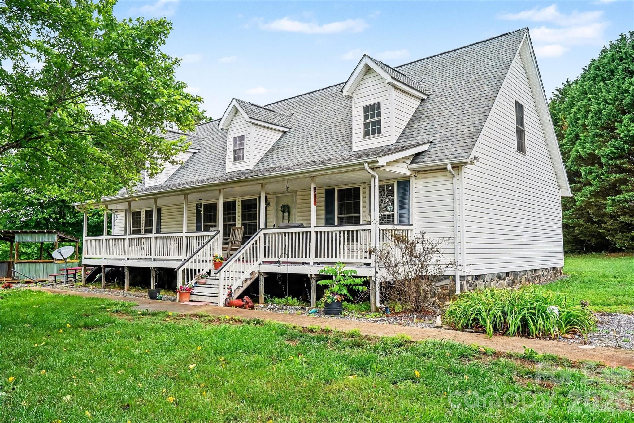 Situated on approximately 2.1 acres of open land, this property offers the space and privacy that’s getting harder to find. Enjoy peaceful country living with plenty of room for outdoor activities, gardening, recreation, or future possibilities. Inside, the home features a functional layout with spacious living area flowing seamlessly into the dining area and a large corner kitchen plus 3 generously sized bedrooms providing space for friends, family or a home office. One of the standout features is the expansive attic space with extra room for 4th bedroom potential, providing exceptional storage potential. Relax on the covered front porch overlooking the wide front yard and private setting. Conveniently located just 2 minutes from the local shops & restaurants of Downtown Maiden and 4 minutes from Hwy 321 getting you up into Hickory or down towards Gastonia and I-85. Wonderful opportunity to perfect your own private retreat with spacious land, storage and practicality all in one package.