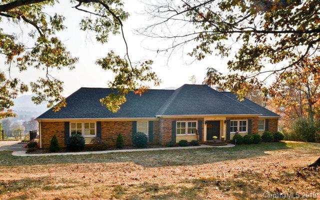 Looking for Convenient Location with a phenomenal View?You MUST SEE this beautifully updated Brick Ranch home.  It features a beautiful open entryway which leads into a spacious Great Room, Dining combination which features beautiful large windows and Plantation Shutters. .The Living room features a brick Fireplace with gas logs, recessed lighting, and easy access to the back porch and VIEWS! Kitchen has been updated in the past few years and features cherry cabinets with self closing drawers and doors, granite countertops with tile backsplash. To the left of the kitchen you'll find, the Laundry room, large Den, & Office with built in custom cabinetry. Master BR features a walk in closet and nice large bathroom with large tile shower, double vanities and granite counters. The exterior of the home features pool, large deck & Landscaping.