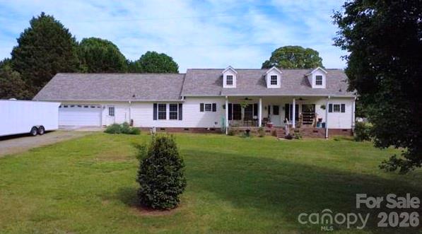 * Seller offering 1 year paid for home warranty * Escape to your own private retreat where peace, space, and natural beauty come together. Nestled on approximately 22.32 acres—featuring 12 acres of open pasture and 10 acres of mature hardwoods—this charming 3-bedroom, 3-bath home offers the perfect blend of comfort and countryside living.  A tree-lined drive welcomes you home, leading to a residence thoughtfully positioned on the front two acres.  Relax on the inviting front porch and take in serene views while watching abundant wildlife pass by.  Inside, the home features beautiful hardwood floors throughout the main living area and two secondary bedrooms. The spacious kitchen is designed for both function and style, complete with granite countertops, tile flooring, a large island with pot rack, built-in double wall ovens and a microwave.  The expansive primary suite is a true retreat, offering his-and-her bathrooms connected by a large walk-in closet.  The garage has a separate heater and a window unit and stairs up to a flex room that is also on that unit. The land itself is a standout feature, with a creek running through the property and an artesian well adding to its natural appeal.  Energy saving solar panels added a few years back. Multiple outbuildings provide incredible versatility, including storage buildings, a large carport currently housing tractor equipment, a workshop, and even a greenhouse.  Large fenced in back yard and even a chicken coop. Whether you’re seeking privacy, room to expand, or investment potential, this property delivers.  Opportunities like this don’t come often—schedule your showing today.